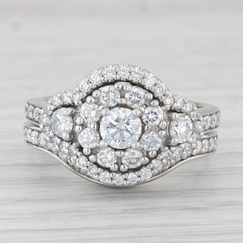 Gemstone Information: Natural Diamonds - 1.40 Total Carats
- Engagement -
Center
Carats - 0.31ct 
Cut - Round Brilliant
Color - H - I
Clarity -SI1 

Halo
Total Carats - 0.48ctw
Cut - Round Brilliant
Cut - F - G
Clarity - VS2 - SI2 

Accents
Total
