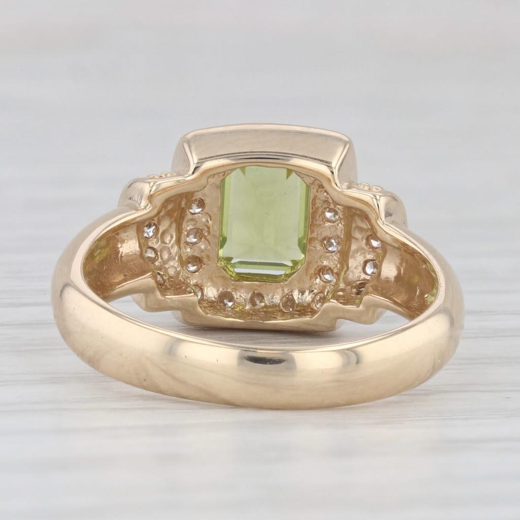 Gemstone Information:
- Natural Peridot -
Carats - 1ct
Cut - Emerald
Color - Light Green

- Natural Diamonds -
Total Carats - 0.40ctw
Cut - Round Brilliant
Color - G - H
Clarity - SI1 - I1

Metal: 14k Yellow Gold
Weight: 4.5 Grams 
Stamps: 14k
Face