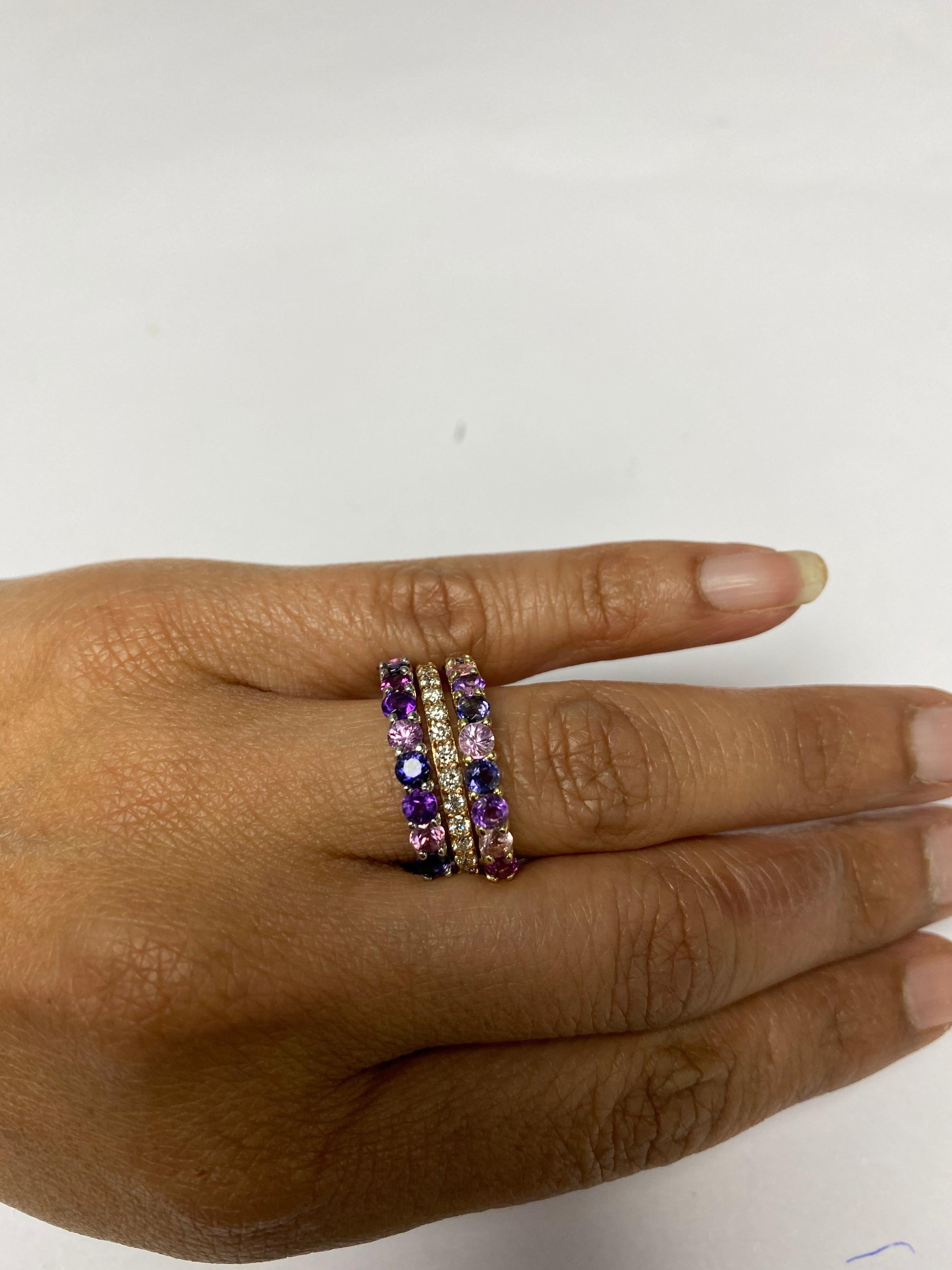 There are 11 Multicolored Genuine Gemstones in this band that weighs 1.41 Carats. The band has a mixture of Pink Sapphires, Amethysts and Purple Garnets!
It is perfect for everyday wear and looks amazing stacked or alone. They are versatile and can