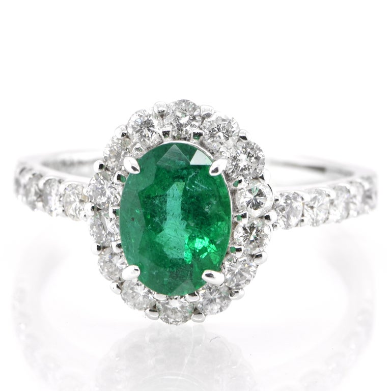 A stunning ring featuring a 1.41 Carat Natural Emerald and 0.81 Carats of Diamond Accents set in Platinum. People have admired emerald’s green for thousands of years. Emeralds have always been associated with the lushest landscapes and the richest