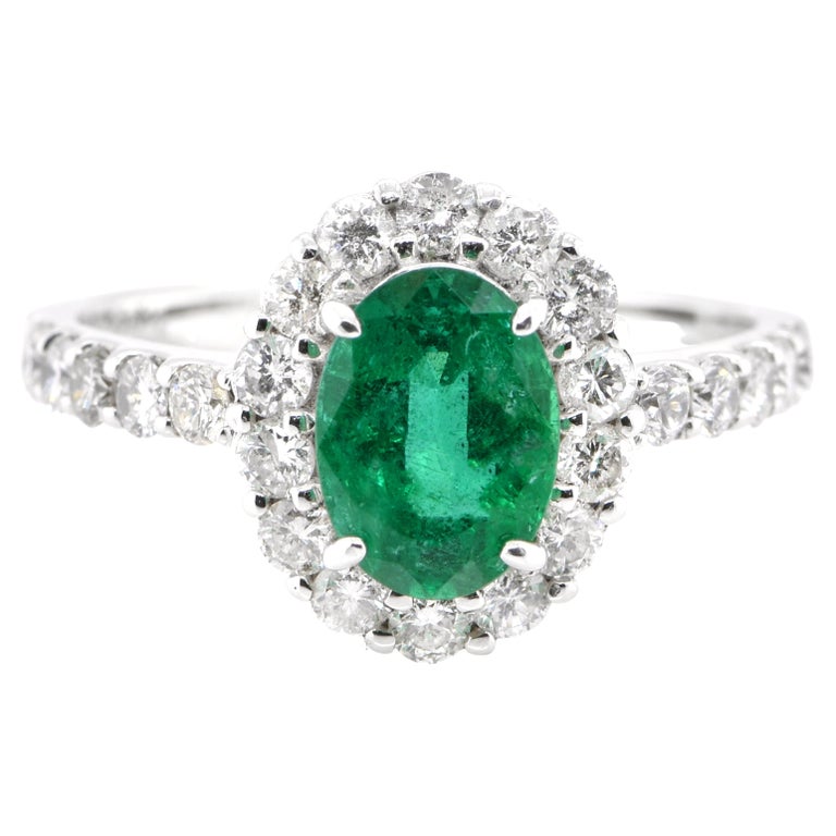 1.41 Carat Natural Emerald and Diamond Halo Ring Set in Platinum For Sale