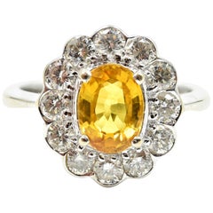 1.41 Carat Oval Cut Yellow Sapphire and Diamond Halo 18 Karat White Gold Ring
