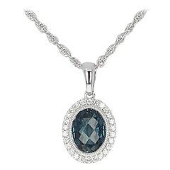 1.41 Carat Oval London Blue Topaz 
Diamond Pendant Necklace, 14 Karat Gold Halo