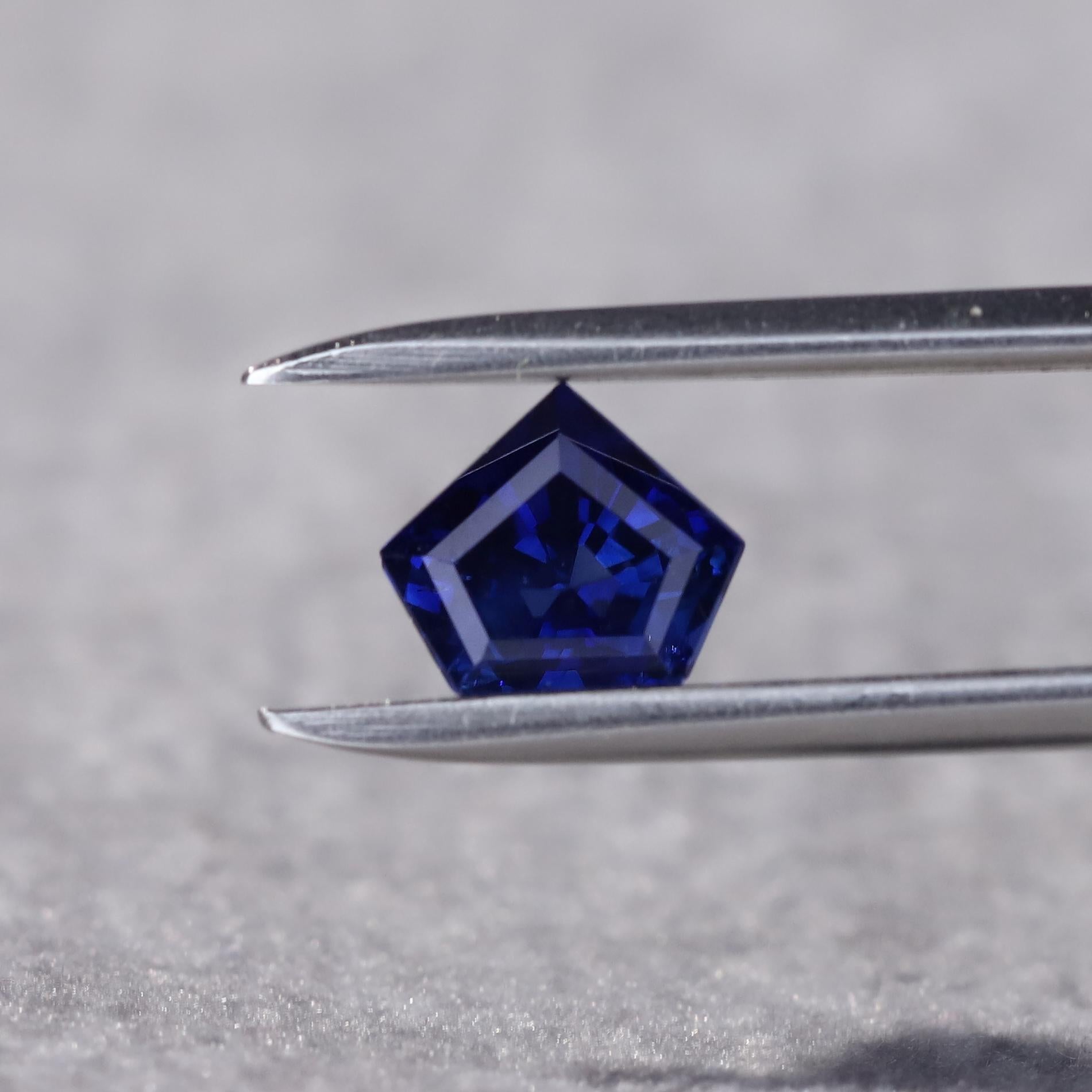This natural sapphire seems as though it holds the secrets of the night sky within its facets, owing to its mystical hues of midnight blue along with the gem’s pristine clarity and unique pentagon form. 

Natural midnight blue sapphire. Sourced from