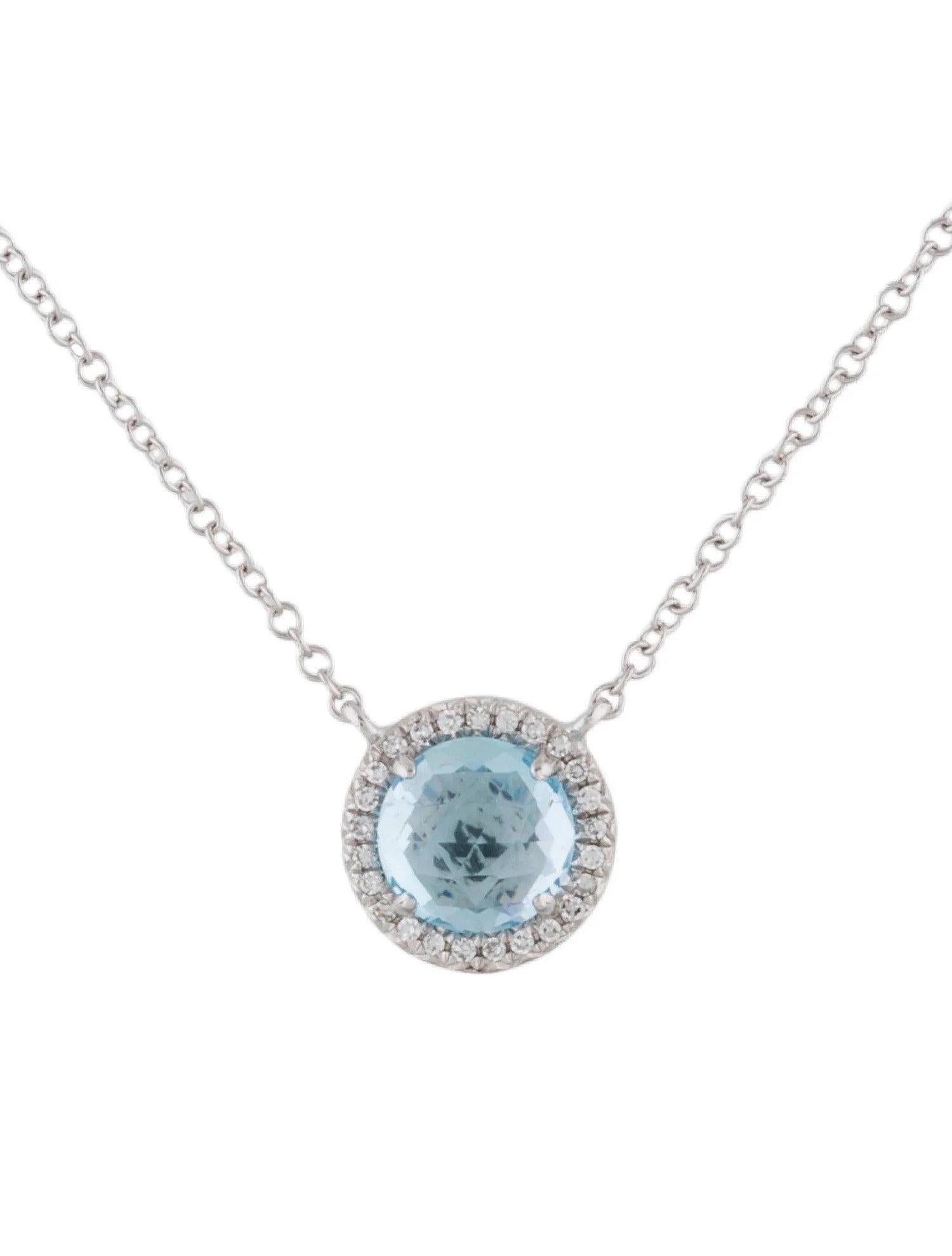 This Blue Topaz & Diamond Pendant is a stunning and timeless accessory that can add a touch of glamour and sophistication to any outfit. 

This pendant features a 1.41 Carat Round Blue Topaz, with a Diamond Halo comprised of 0.06 Carats of Single