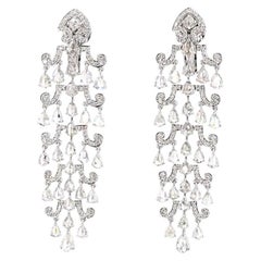 Boucles d'oreilles en or serties d'un diamant rond taille brillant de 1,41 carat