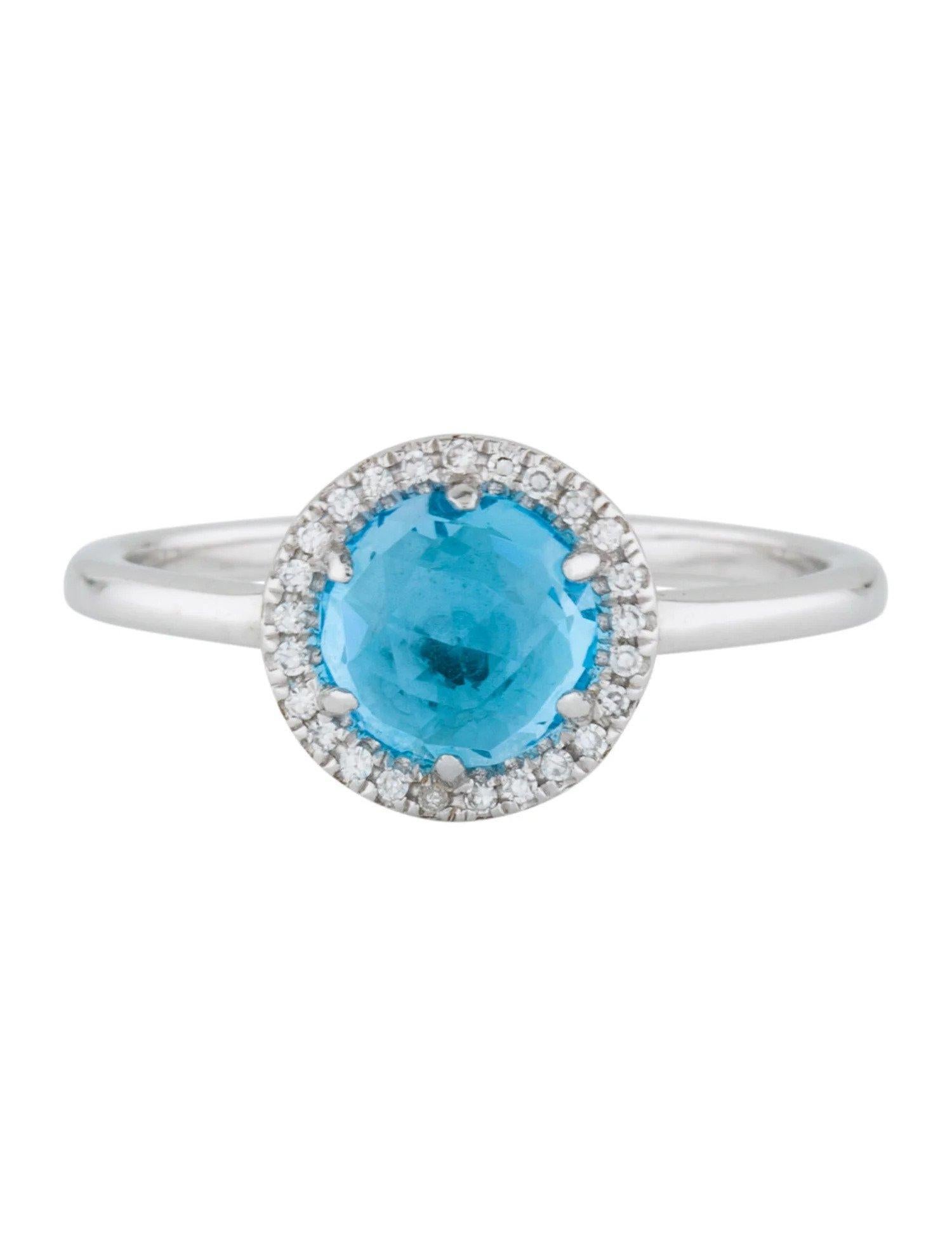 Cette bague suisse en topaze bleue et diamant est un accessoire étonnant et intemporel qui peut ajouter une touche de glamour et de sophistication à n'importe quelle tenue. 

Cette bague présente une topaze bleue suisse ronde de 1,41 carat, avec un