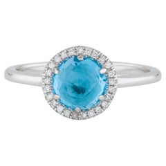 Bague en or blanc avec topaze bleue suisse ronde de 1,41 carat et diamants