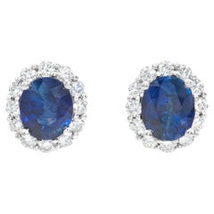 1.41 Carats Oval Cut Blue Sapphire 
Diamond Halo Stud Earrings in White Gold