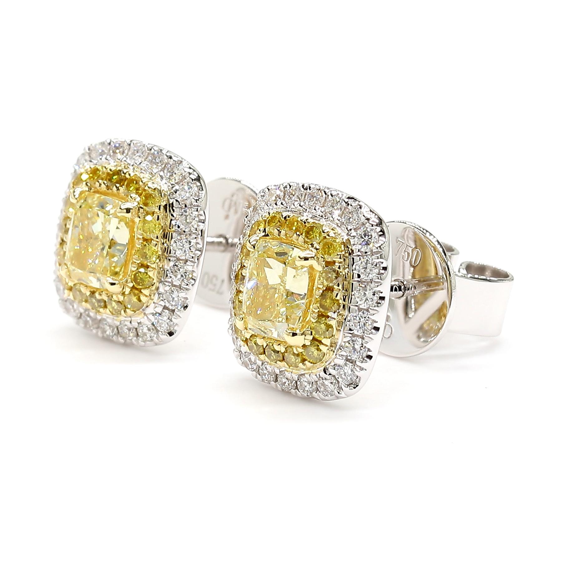 This Fancy Yellow Cushion Cut pair of stud earrings with a double halo are a testament to fine craftsmanship and timeless design. Perfect for those who appreciate the beauty of natural diamonds, these earrings offers a balance of luxury and tasteful
