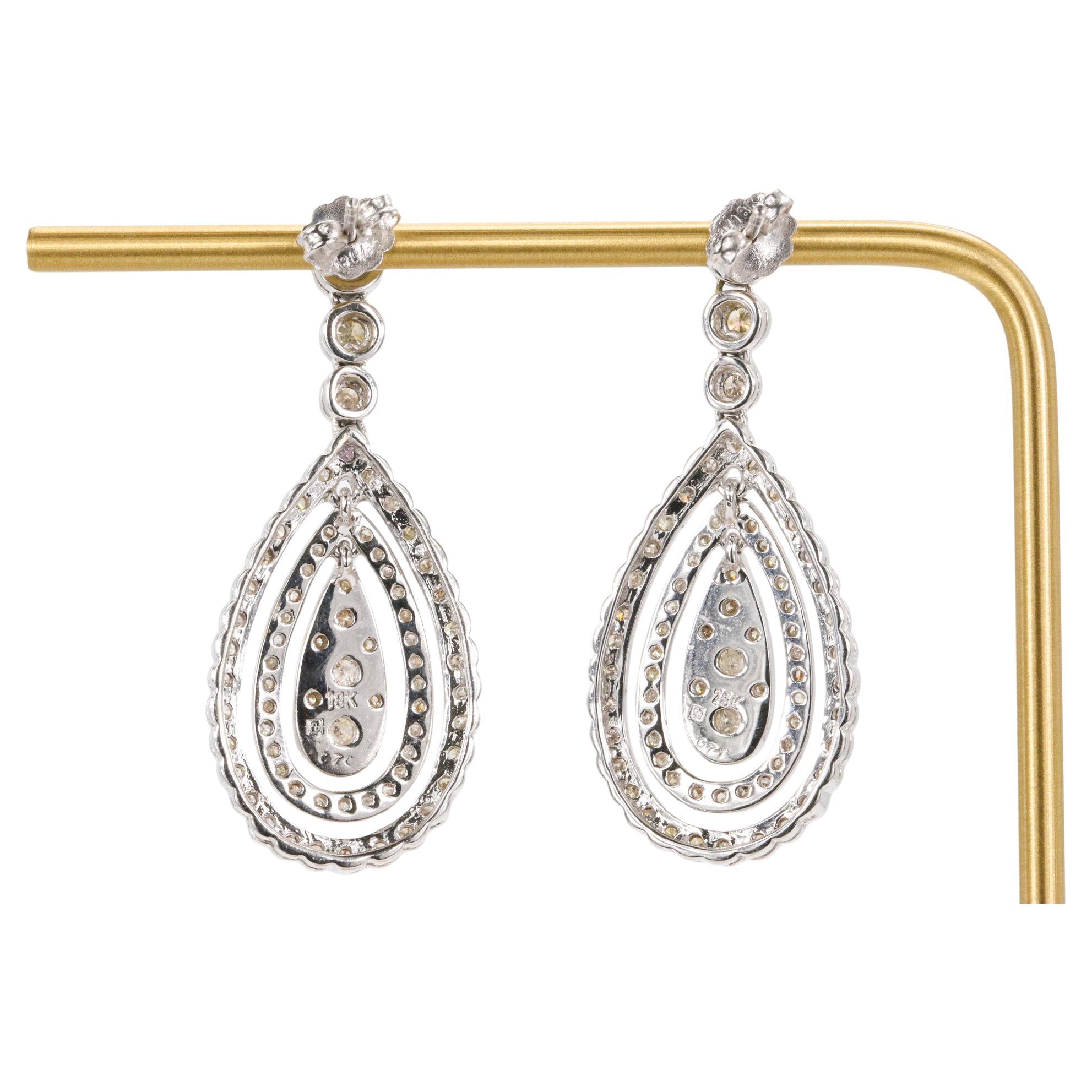 1.41 CTW Round Brilliant Diamond Dangle Earrings in 18k White Gold

Crafted in luminous 18k white gold, these elegant diamond earrings feature a refined drop silhouette adorned with 148 round brilliant natural diamonds. The design combines delicate