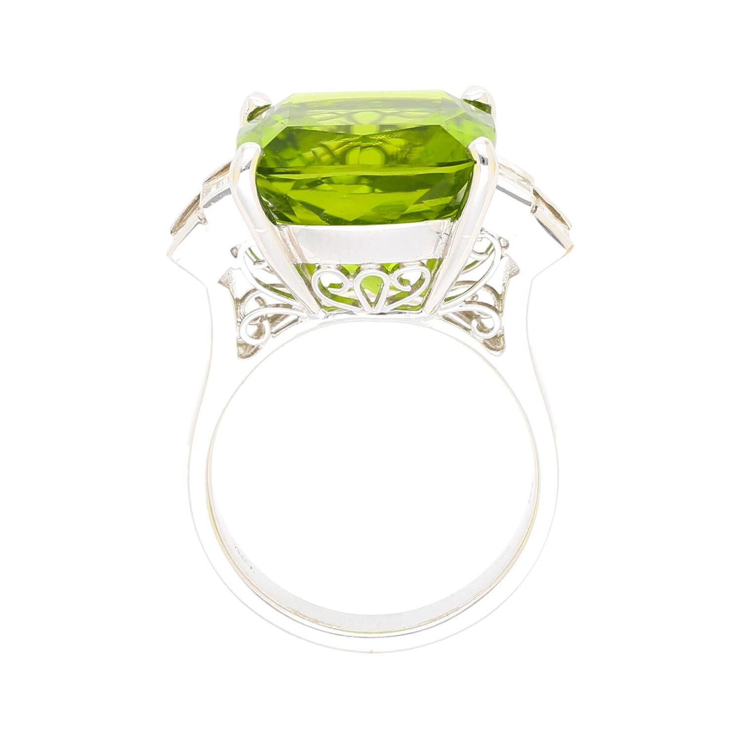 Modern 14.11ct Green Peridot and 0.91ctw Diamond Side-Stones in 18k White Gold Ring For Sale
