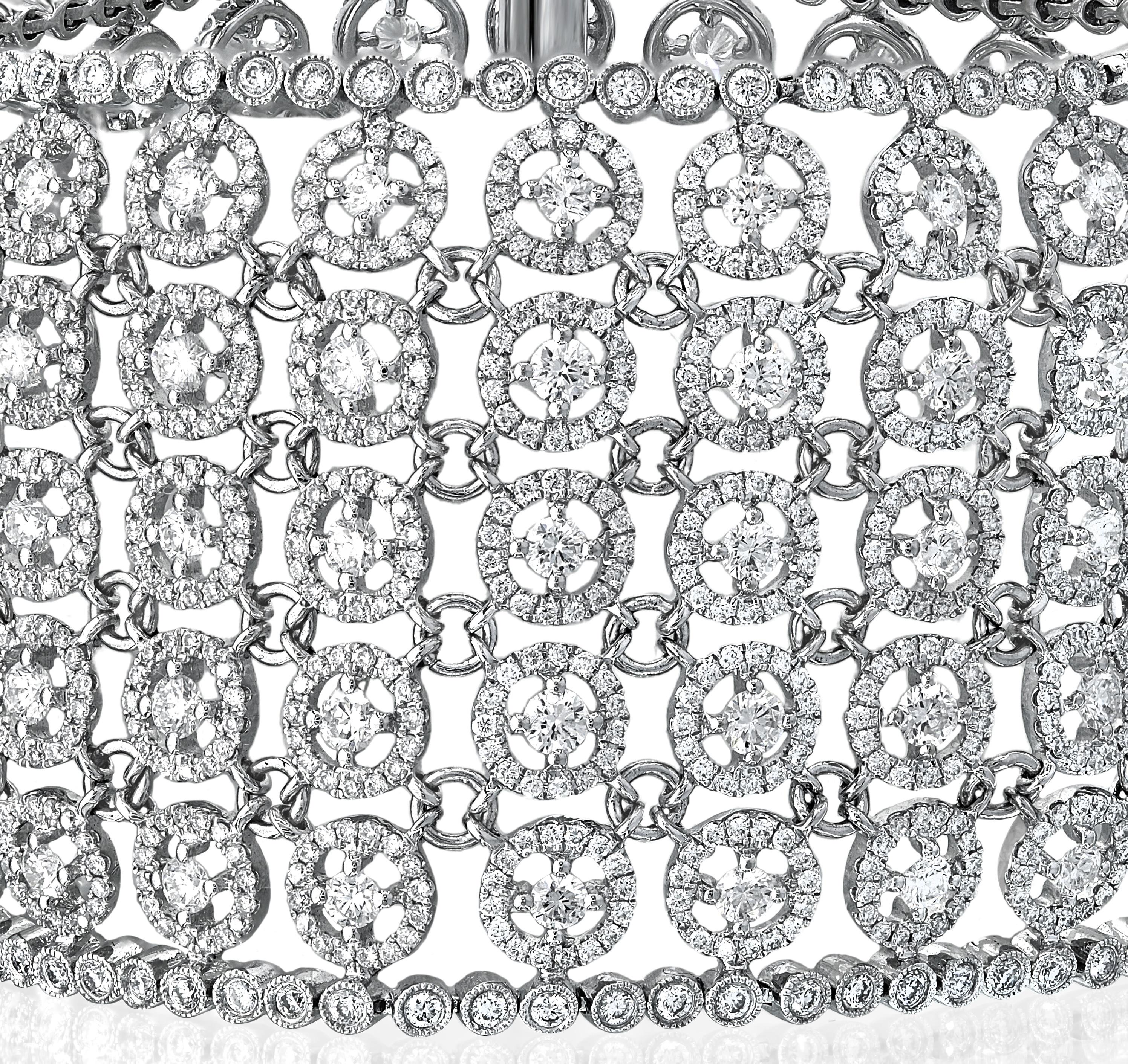 This bracelet is a masterpiece that seamlessly blends delicacy with opulence. Crafted with precision and adorned with a total of 14.12 carats of natural round diamonds, this bracelet is a true embodiment of timeless beauty.

Picture yourself adorned