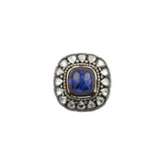14, 12 Carat Tanzanite 4, 12 Carat Diamond 18 Karat Rose Gold Heritage Ring