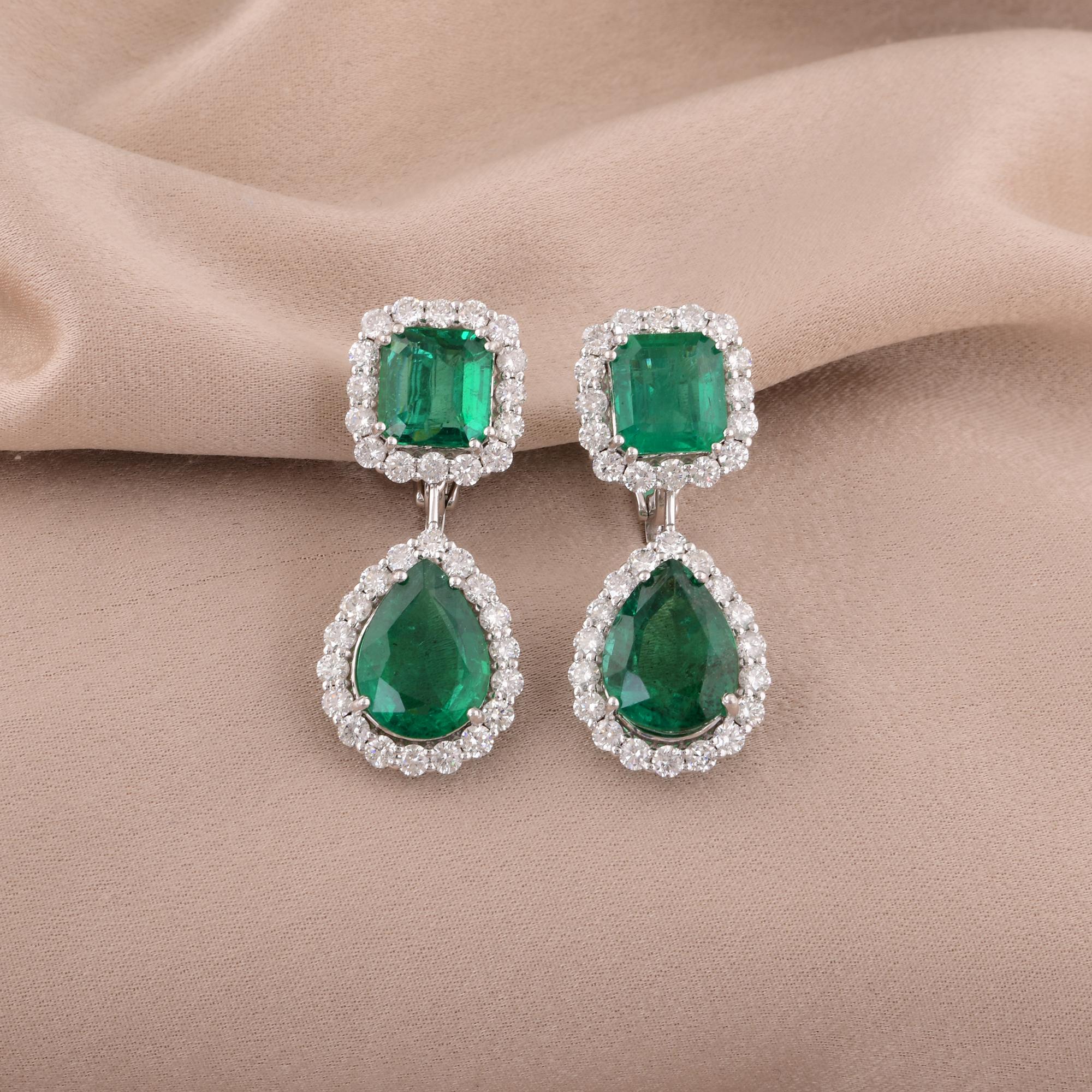 Exude elegance and sophistication with these stunning 14.16 Total Carat Weight (TCW) dangle earrings. Featuring a breathtaking combination of vivid green Zambian emeralds and sparkling round-cut diamonds, these earrings are a masterpiece of fine