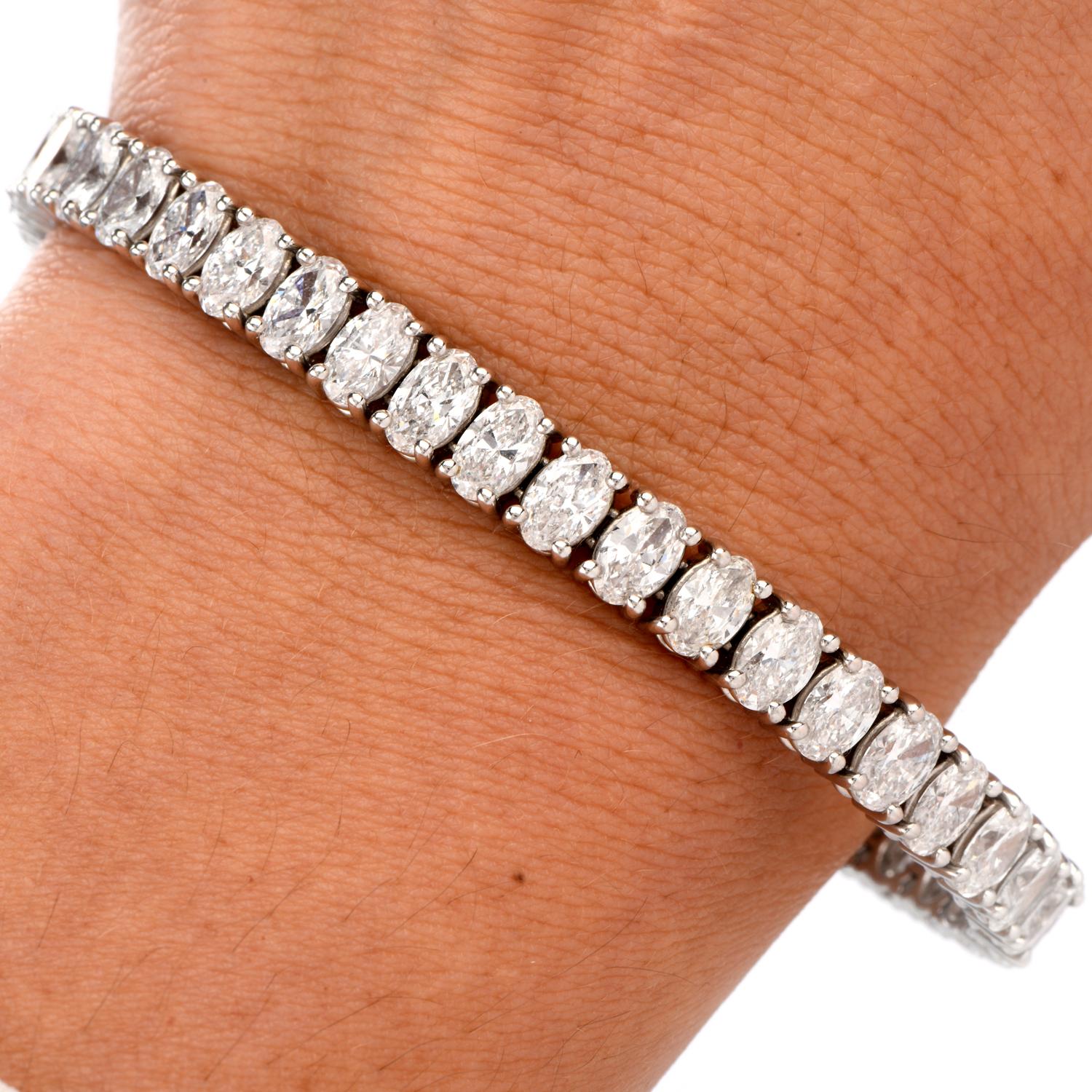 Fire, Sparkle and Brilliance all radiate from this Oval Diamond Line Bracelet.

Crafted in Luxurious Platinum and 18K white gold clasp, 

this bracelet contains 42 collection diamonds ideally matched oval faceted diamonds.

Total diamond weight is