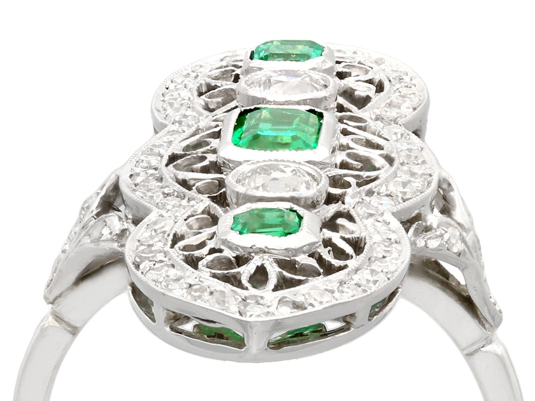 A stunning, fine and impressive antique 0.60 carat emerald and 1.41 carat diamond, 14 karat white gold marquise shaped cocktail ring; part of our diverse antique jewelry and estate jewelry collections.

This stunning antique 1920s emerald cut