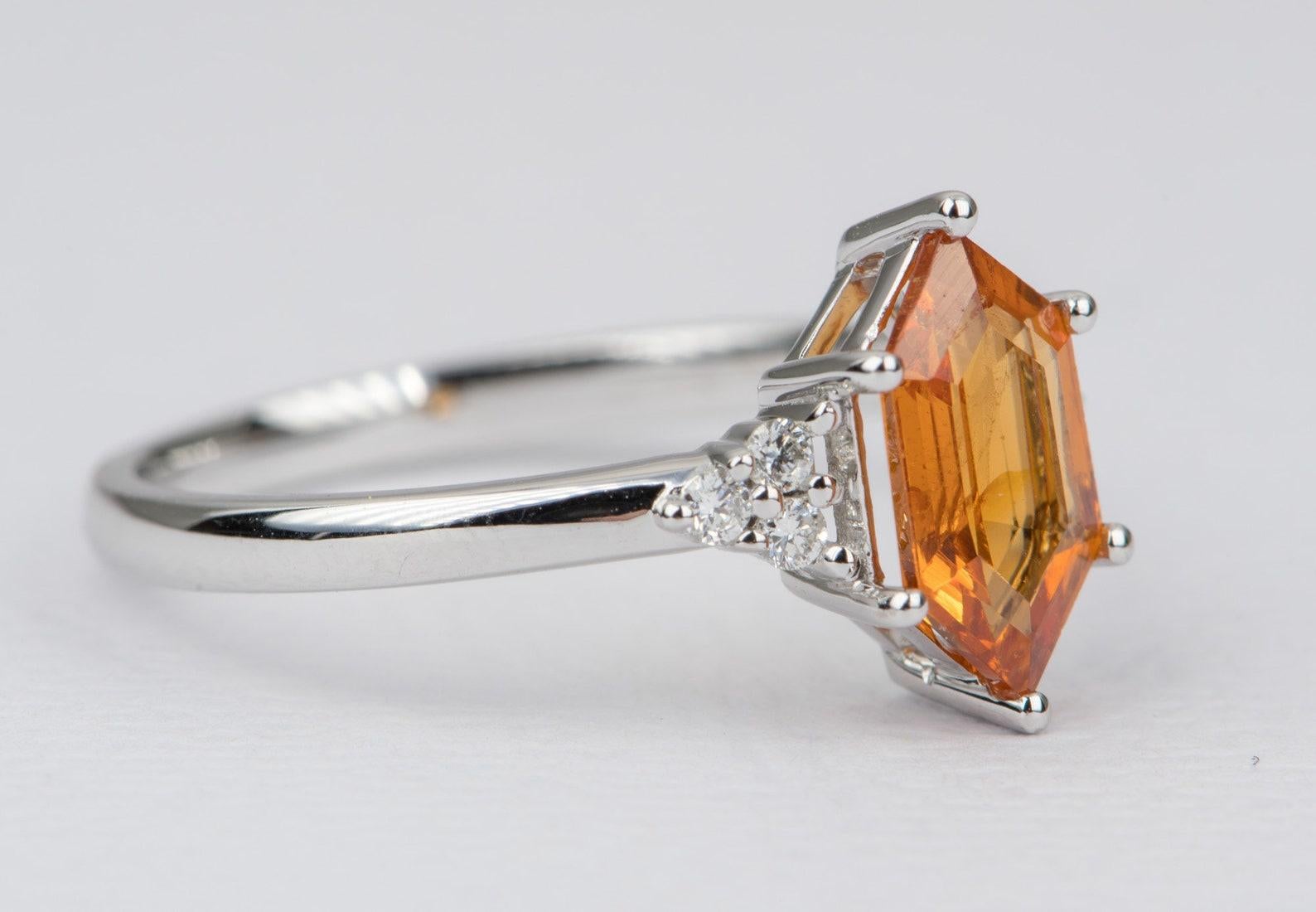♥  This is a beautiful 14K gold ring set with a hexagon-shaped mandarin garnet in the center, flanked by brilliant clear diamonds on each side
♥  The overall setting measures 12.0mm in width, 11.0mm in length, and sits 4.4mm tall from the finger

♥ 