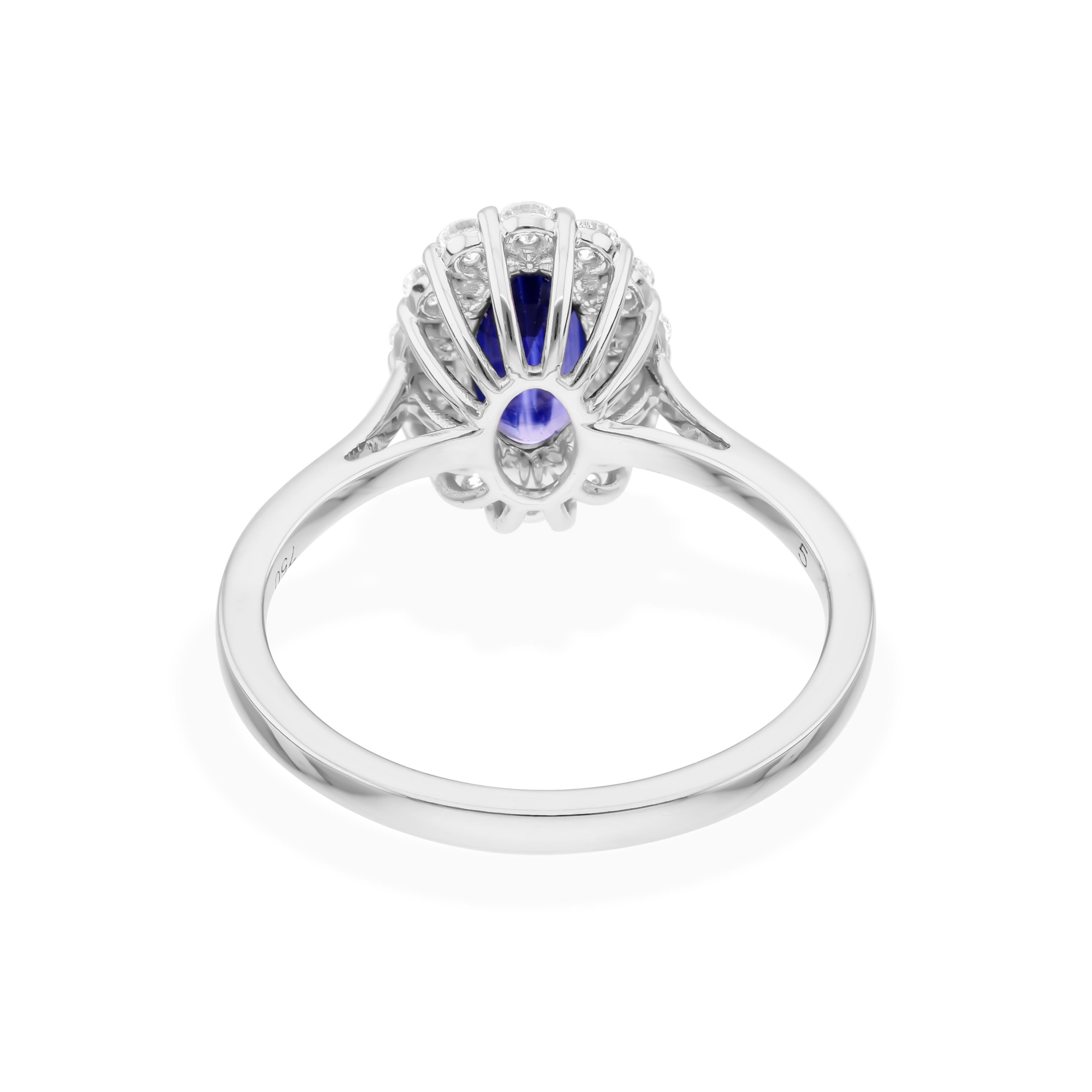 Cast from 18-karat gold, these exquisite ring is handset with 1.42 carats blue sapphire and 0.37 carats of sparkling diamonds.

The ring is a size 7 and may be resized to larger or smaller upon request. FOLLOW SPECTRUM JEWELS storefront to view the