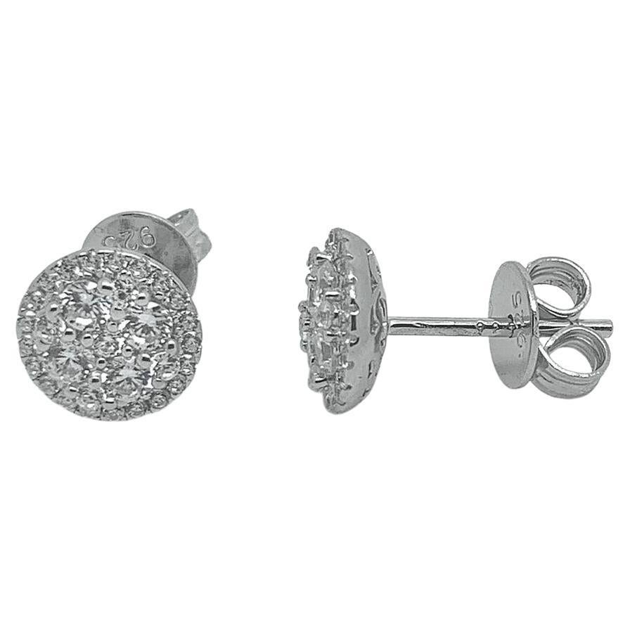 A sparkling, versatile pair of stud earrings, which will take you effortlessly from desk to disco.

Composed of 925 sterling silver with a white high gloss rhodium finish.

Also available with either a 14kt rose gold or 14kt yellow gold finish.

At