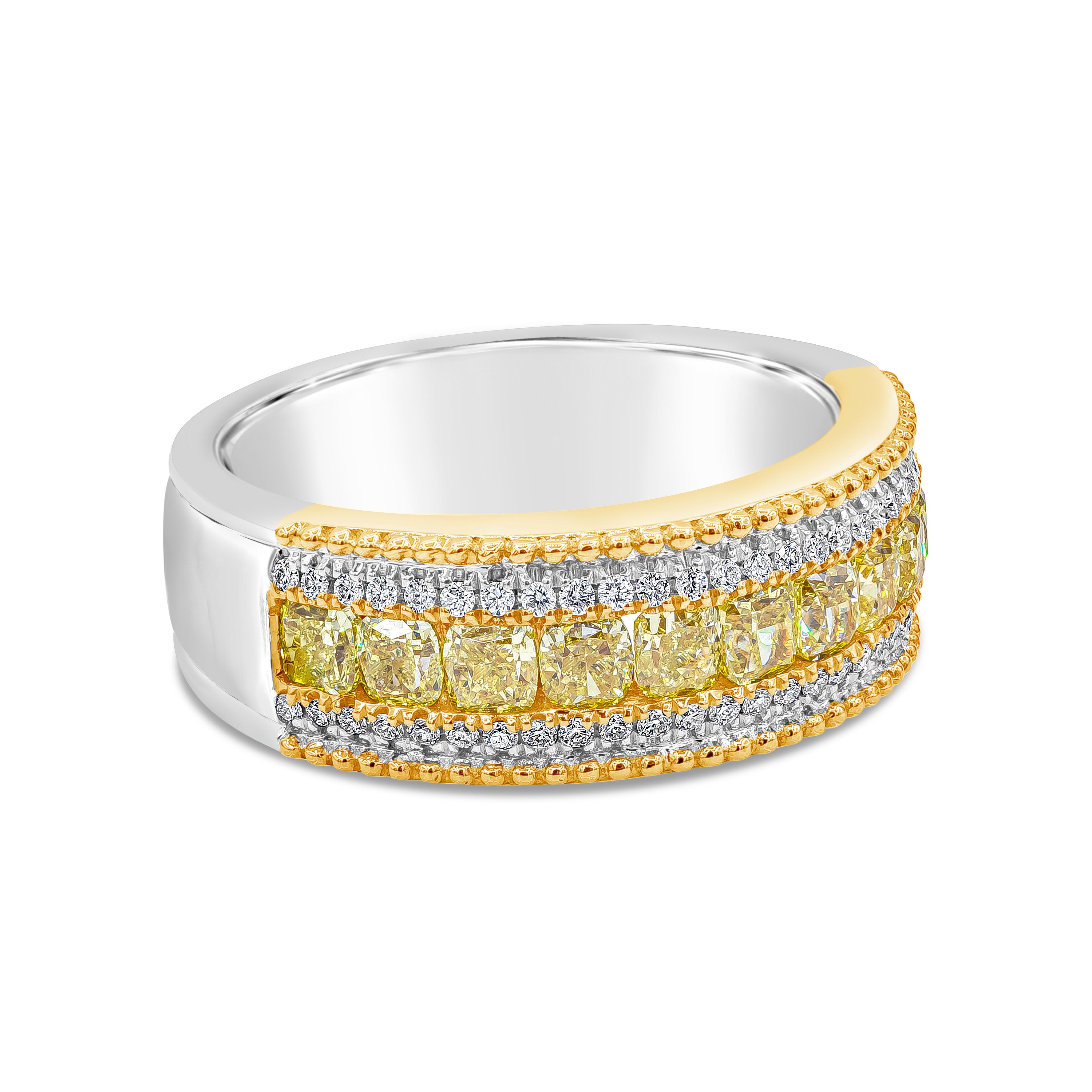 A unique and fashionable ring showcasing a row of cushion cut Fancy Yellow diamonds weighing 1.42 carats total. Channel set between round brilliant diamonds  weighing 0.18 carats total. Finished with beaded edges, made with 18K White and Yellow