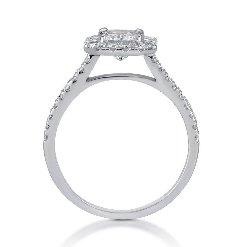 This 1.42 ct diamond engagement ring is breathtaking! It all starts with the spectacular 1.00 carat emerald cut center diamond. It is GIA certified at G-VS2. It is very white, exceptionally well cut and very clear! It is accented by a halo of round