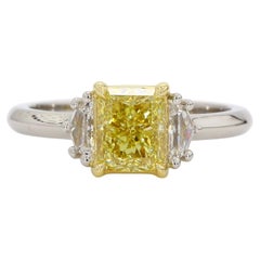 1.42 Carat Fancy Yellow Diamond Three-Stone Engagement Ring, GIA, IF, Platinum.