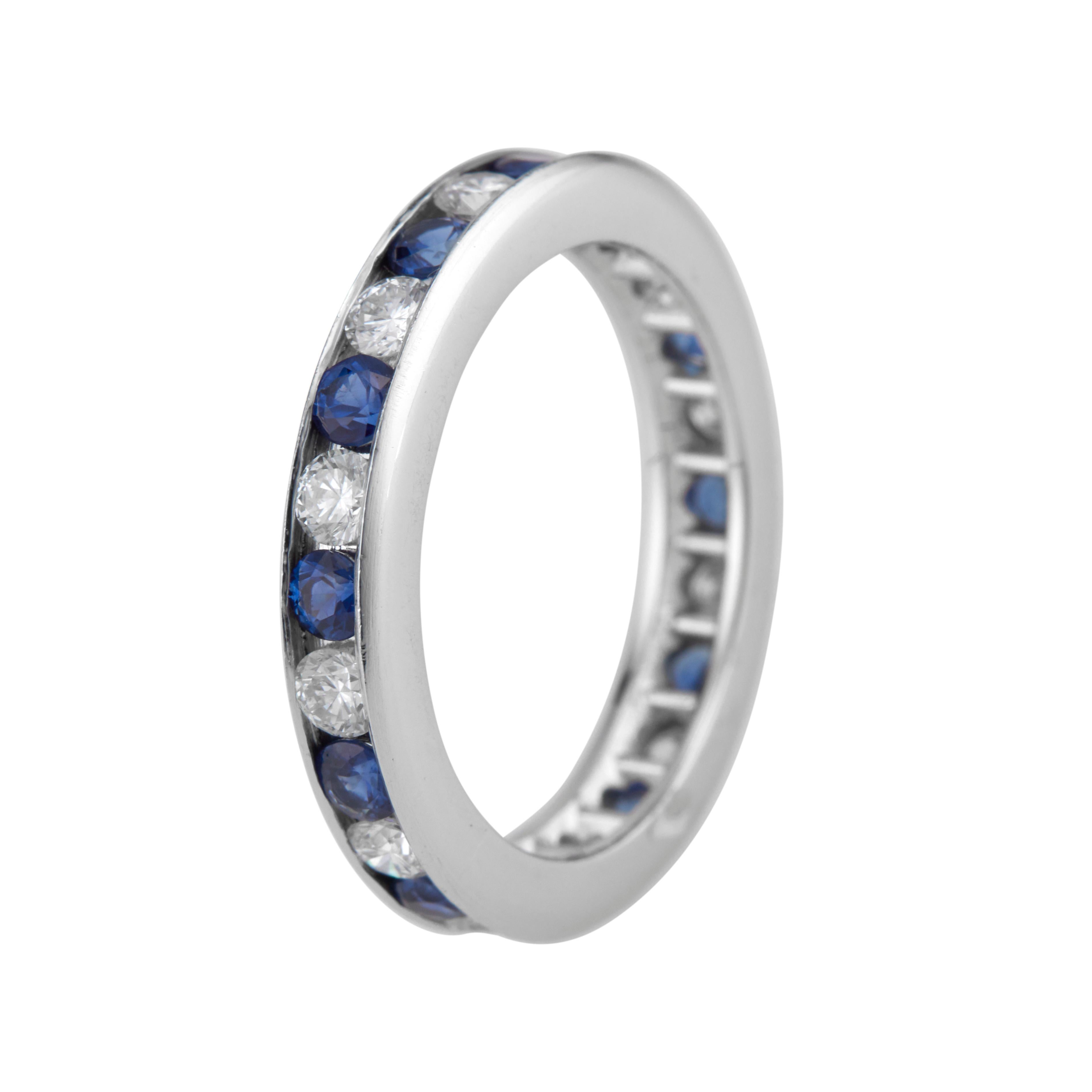 Sapphire diamond eternity wedding band. 12 round diamonds alternating with 12 round sapphires in a platinum setting. 

12 round cut diamond approx. total weight .72cts F, VS
12 round cut sapphires approx. total weight .70cts 
Size: 6 
Test platinum
