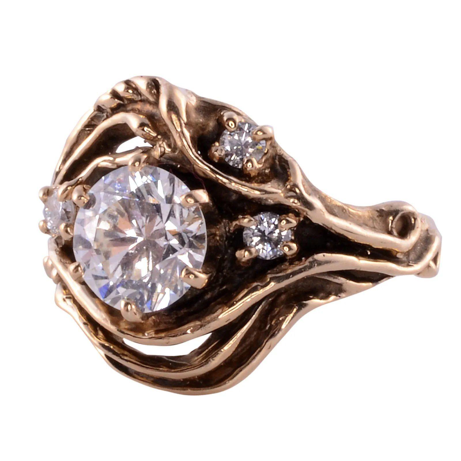 Estate 1.42 carat VS2 center diamond ring, circa 1980. This 14 karat yellow gold ring features a 1.42 carat center diamond having VS2 clarity and K color. There are also three accent diamonds at .11 carat total weight having SI clarity and I-J