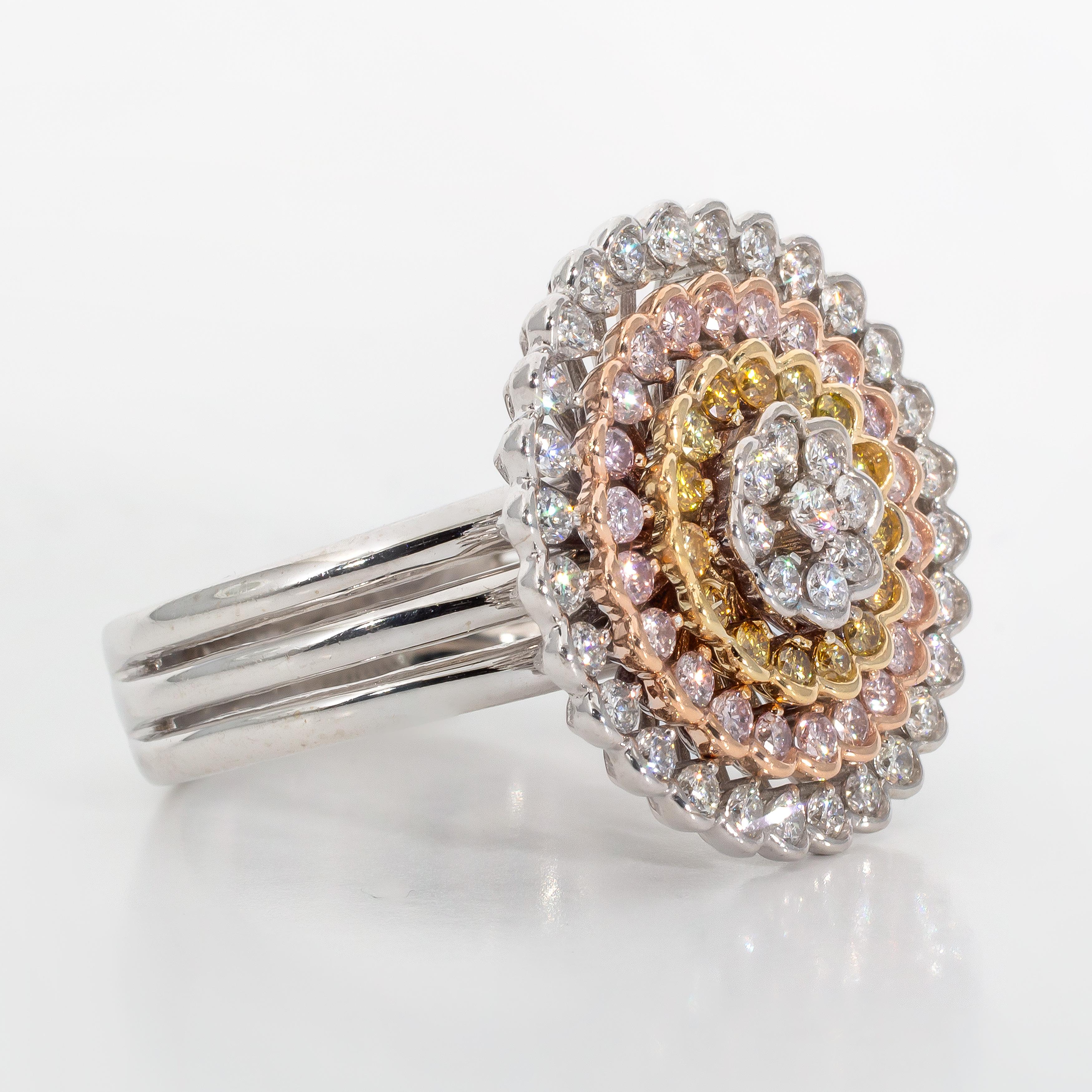 18k white gold ring with yellow and rose gold accents containing 1.42 carats of prong and half-bezel set diamonds. The diamonds have been graded internally as SI1-SI2 clarity. The white diamonds have been graded internally as G-H color. The yellow