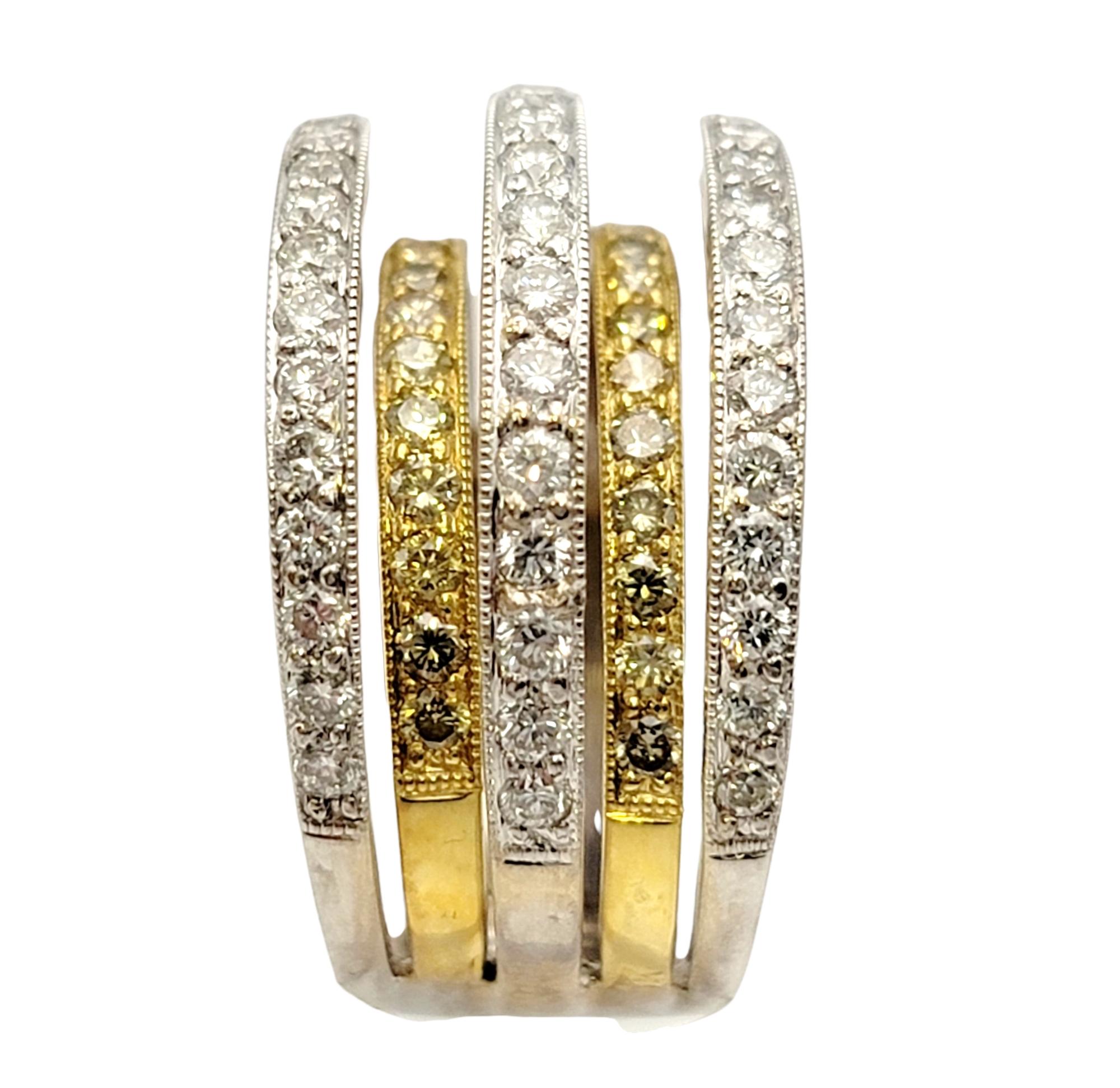 Ring size: 6.75

This stunning five row diamond band ring wraps elegantly around the finger and fills it with sparkle from end to end. Featuring a contemporary two-toned design, this ring offers both beauty and individuality. The unique high/low