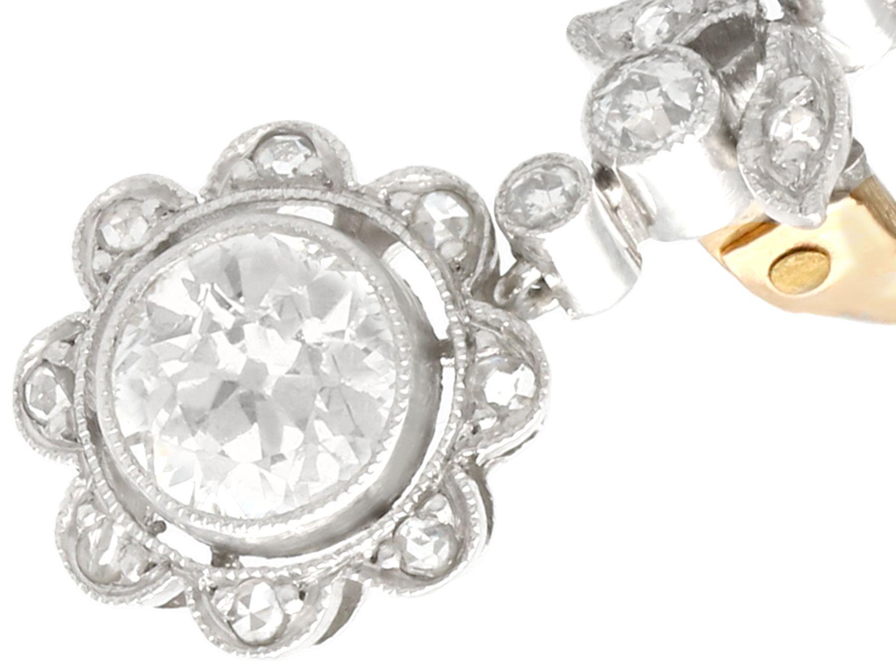Round Cut Antique 1.42 Carat Diamond and Platinum Floral Drop Earrings For Sale