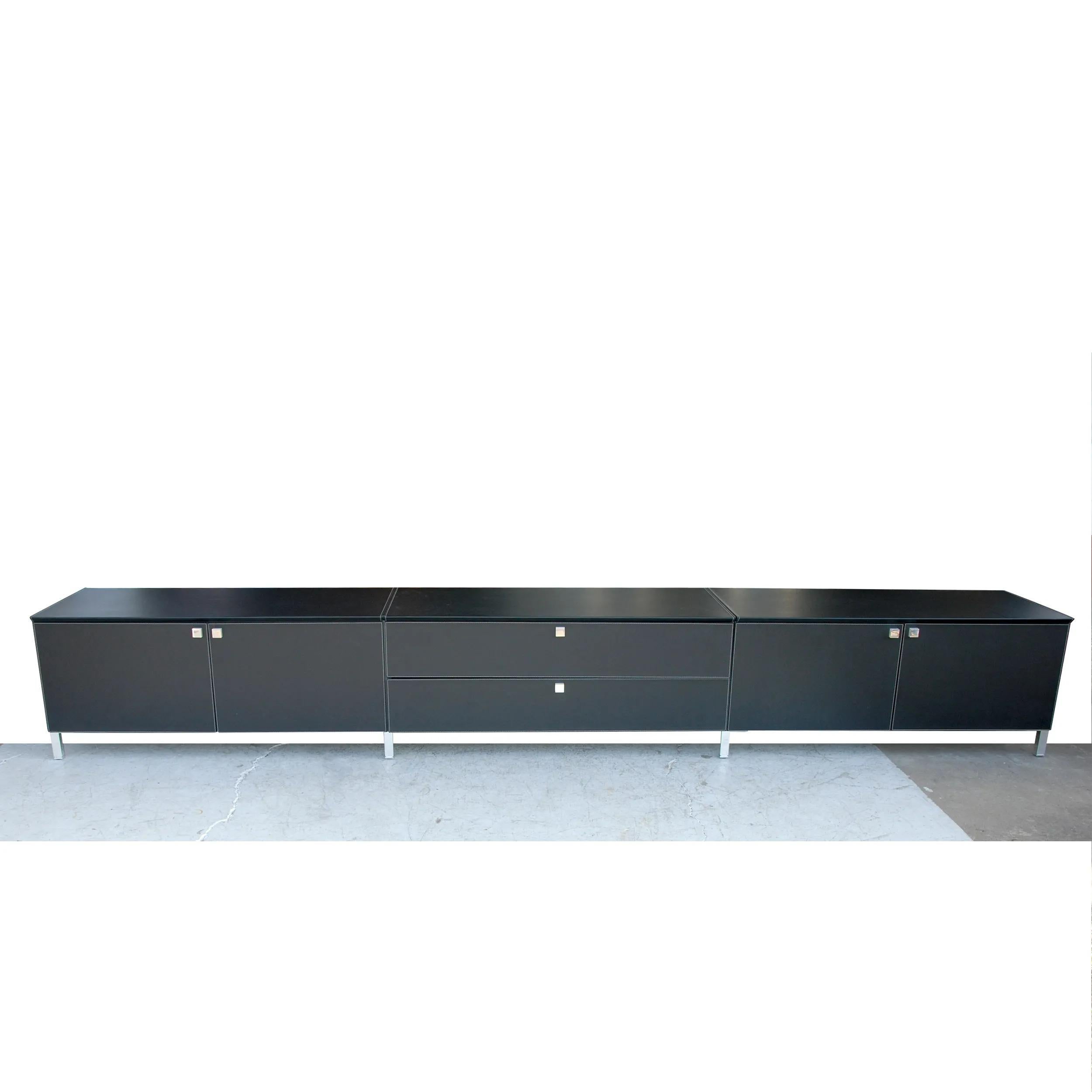 142 Poltrona Frau Low Console Unit in Italian leather

Monumental cabinet featuring ample shelving and drawers. Chrome legs and pulls. Cabinet compartments with adjustable-height shelves.

All visible surfaces, the top, sides, the backside and doors