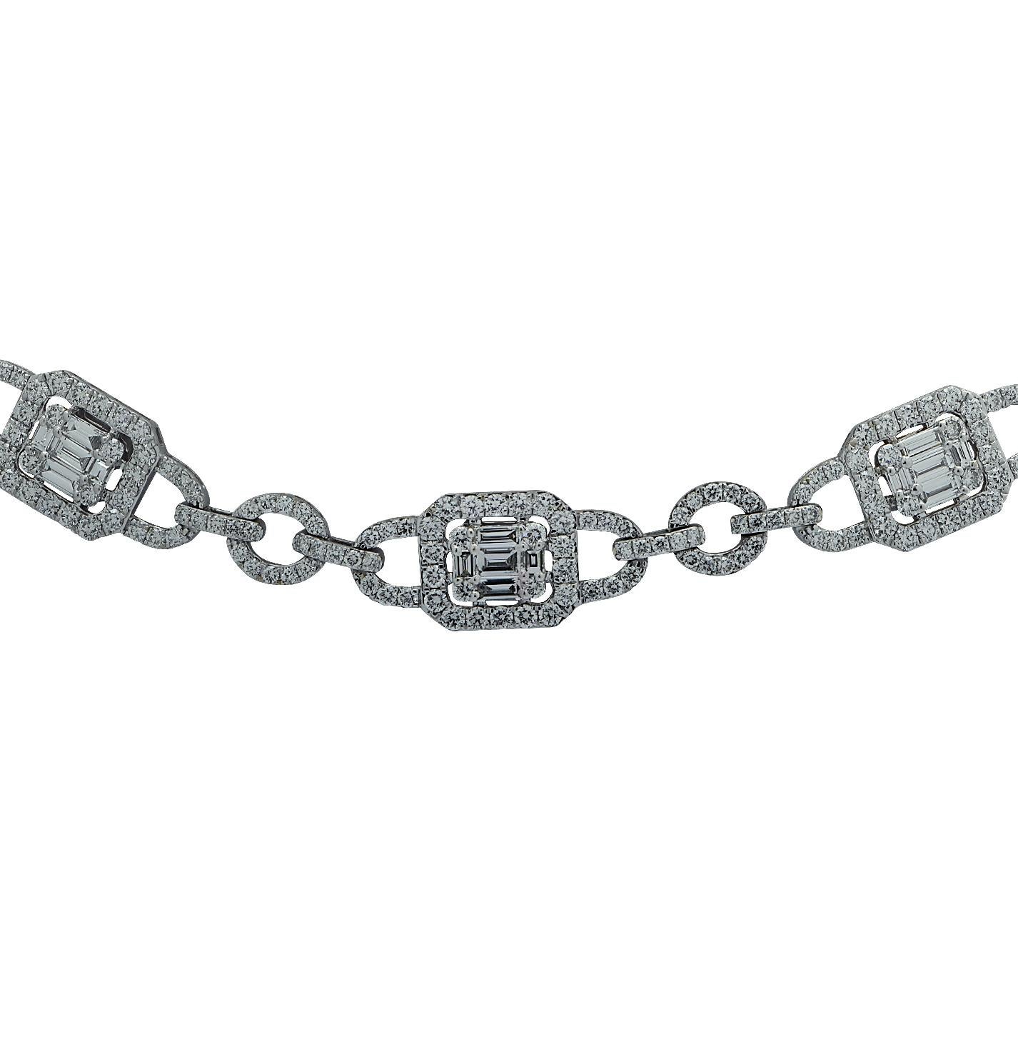 Stunning Diamond Cluster necklace crafted in 18 karat white gold, featuring 782 baguette cut and round brilliant cut diamonds weighing 14.20 carats total, G-H color, SI clarity. The diamonds are set in rectangular shape clusters framed with diamond