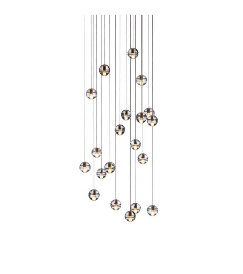 14.20 chandelier lamp by Bocci
Dimensions: D 30 x W 132 x H 300 cm 
Materials: Brushed Nickel, Cast glass, blown borosilicate glass, braided metal coaxial cable, electrical components, white powder-coated canopy.
Available in Rectangular, Round,