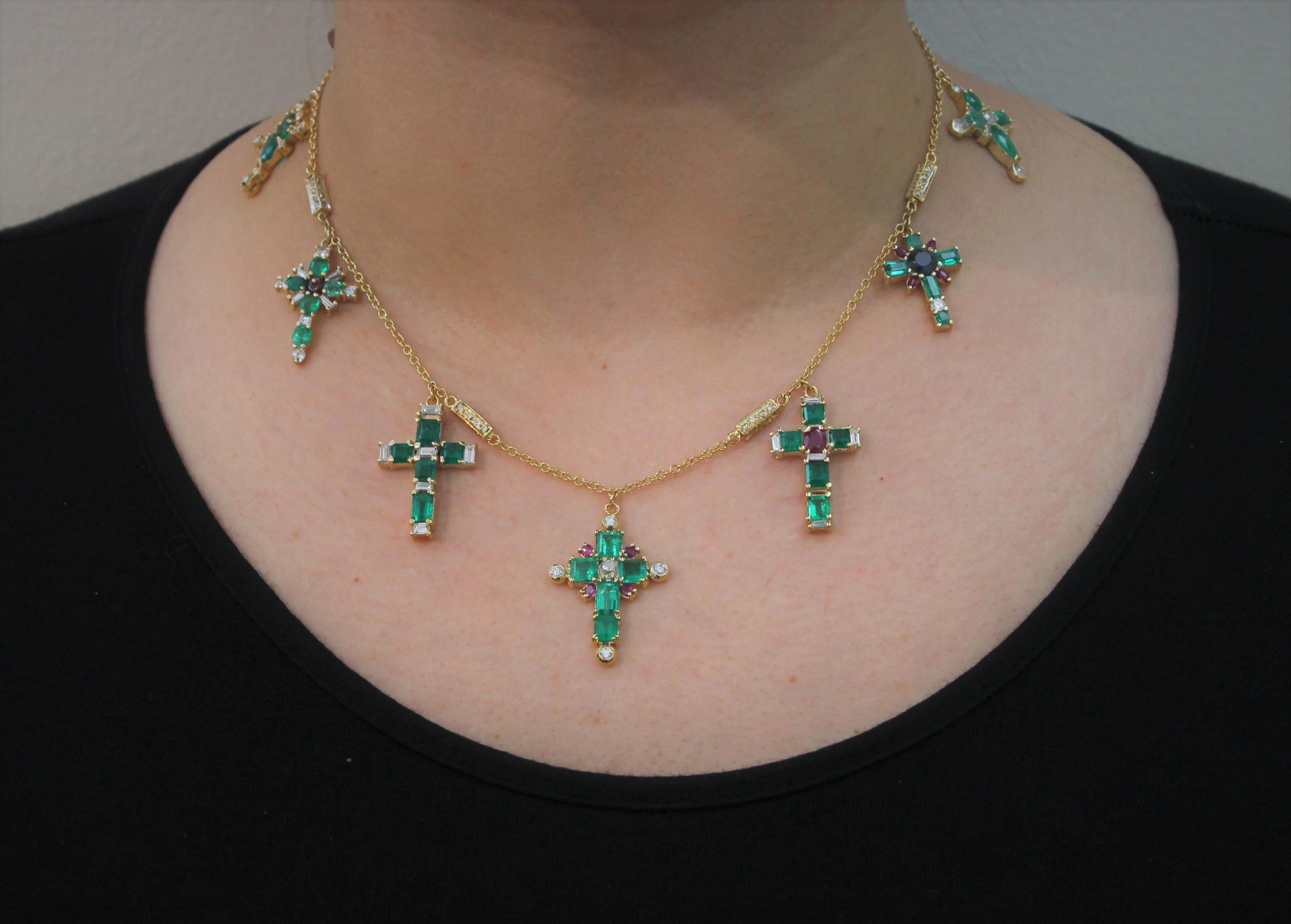 7 Emerald Crosses enriched with Diamonds, Ruby and Sapphire Charms Necklace Hand-Made in Italy . 
The Chain of the Necklace has 6 diamond elements. It is in Yellow-Plated White Gold and is 16