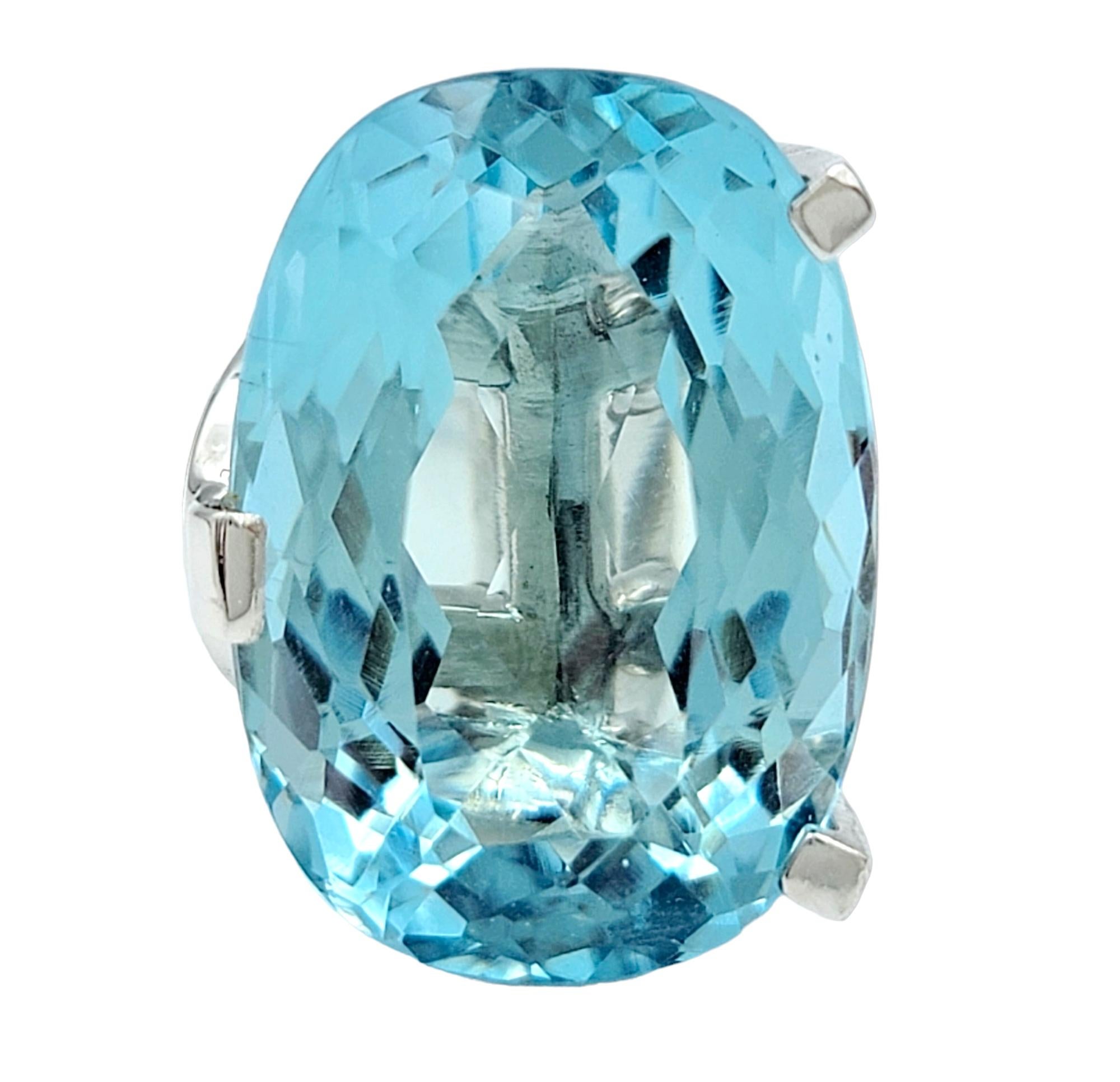Ring size: 5.25 

This exquisite piece of fine jewelry boasts a magnificent 14.25 carat aquamarine as its centerpiece, creating a truly captivating focal point. The aquamarine's enchanting blue hue, akin to the serene expanse of the sky,