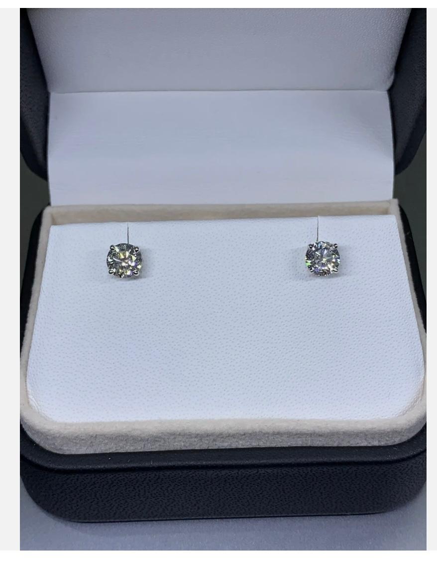 Modern 1.42ct Diamond certified solitaire studs earrings 18ct white gold For Sale