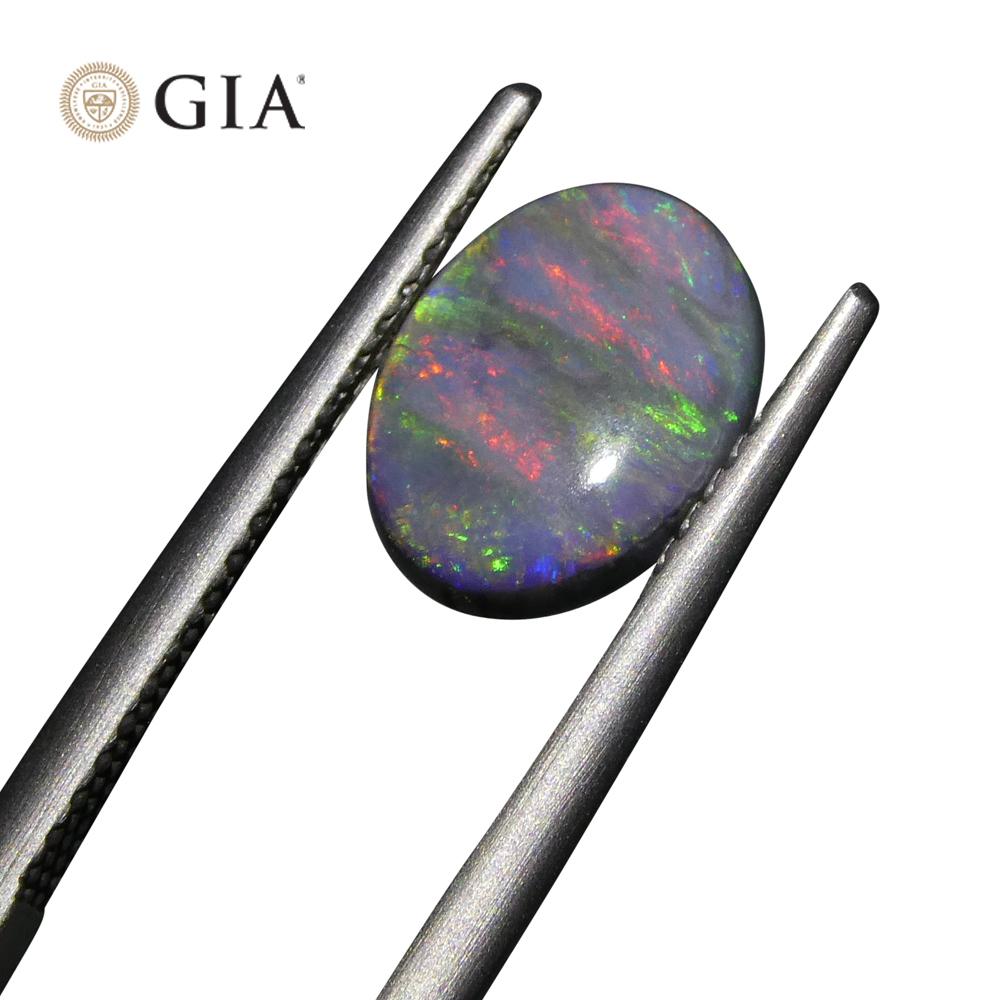 This is a stunning GIA Certified Opal


The GIA report reads as follows:

GIA Report Number: 6227841105
Shape: Oval
Cutting Style: Cabochon
Cutting Style: Crown:
Cutting Style: Pavilion:
Transparency: Semi-Translucent
Color: Black


RESULTS
Species: