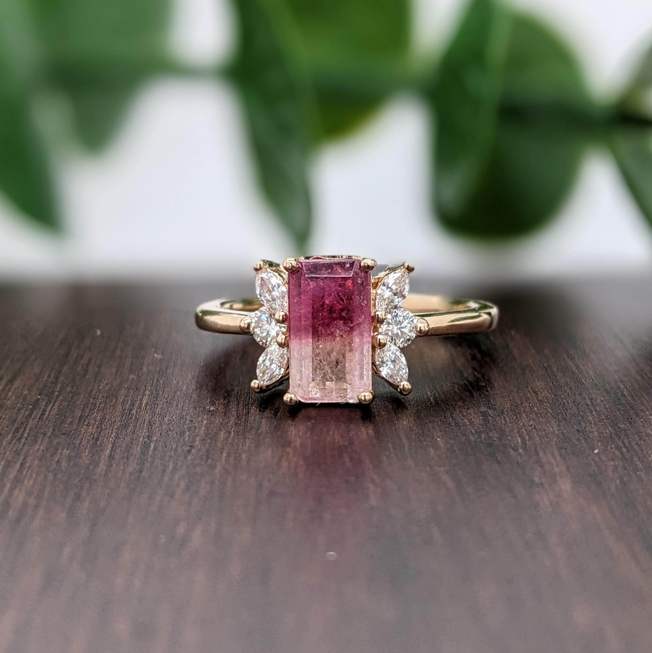 This two hue statement ring features a beautiful bi-color tourmaline in 14k yellow gold with marquise and round diamond accents. A stunning ring design perfect for an eye catching engagement or anniversary. This ring also makes a beautiful