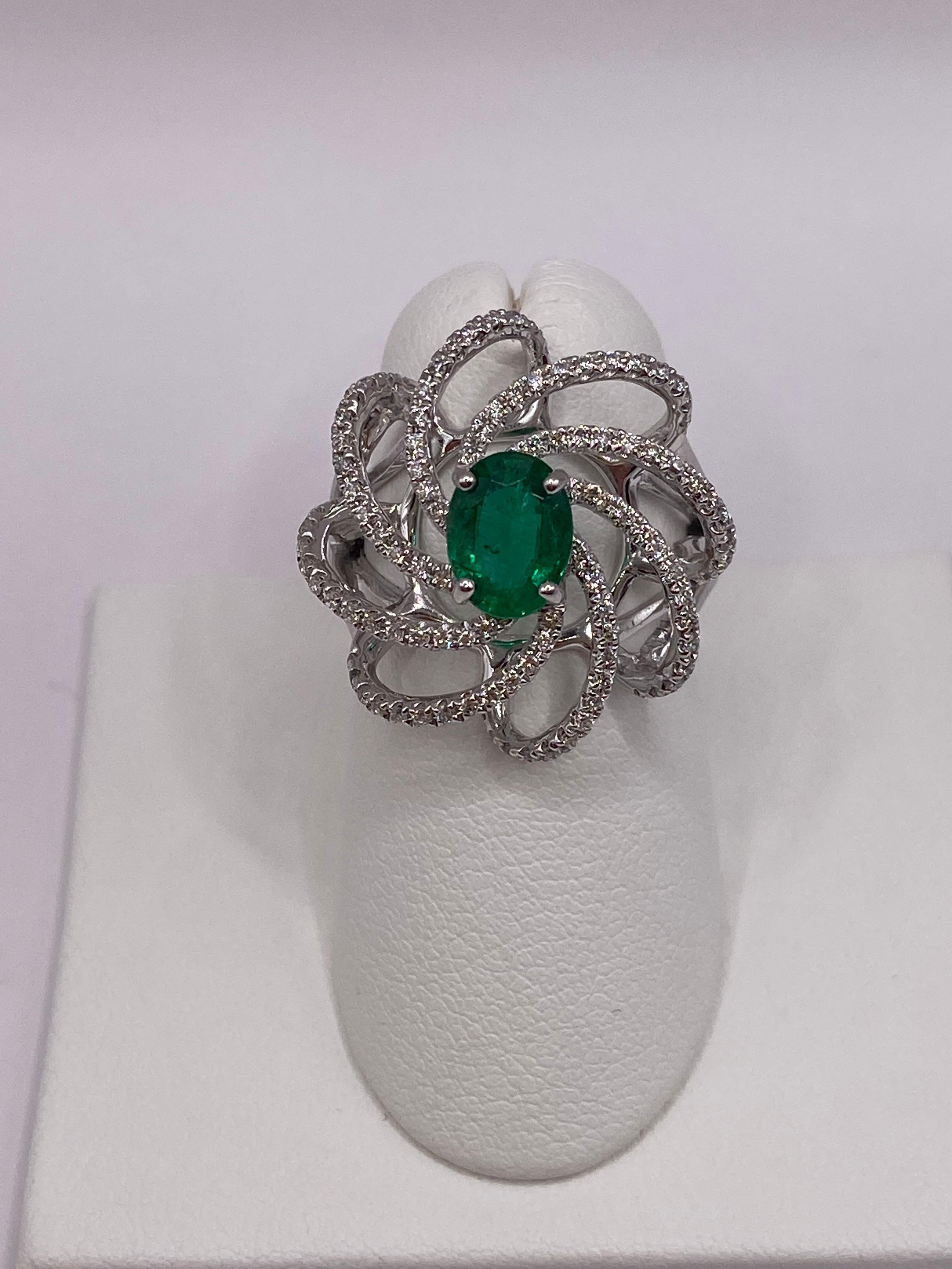 Metal: 18KT White Gold
Finger Size: 6.5
(Ring is size 6.5, but is sizable upon request)

Number of Oval Emeralds: 1
Carat Weight: 0.94ctw
Stone Size: 7.75 x 5.85mm

Number of Round Diamonds: 108
Carat Weight: 0.48ctw