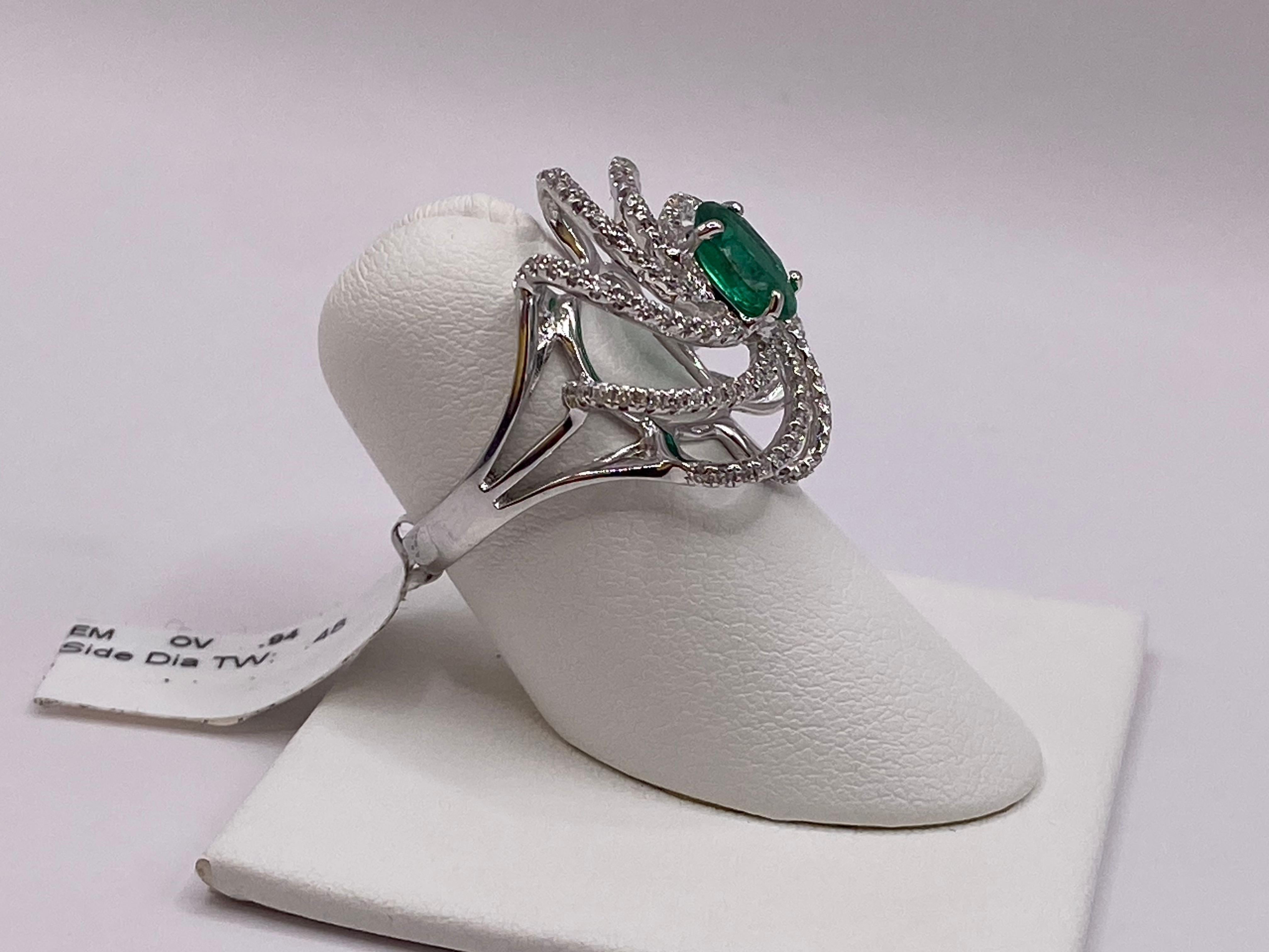 Modern 1.42ctw Oval Emerald & Round Diamond Ring in 18KT White Gold For Sale