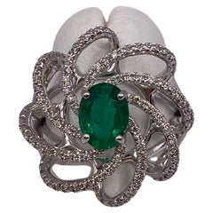 1.42ctw Oval Emerald & Round Diamond Ring in 18KT White Gold