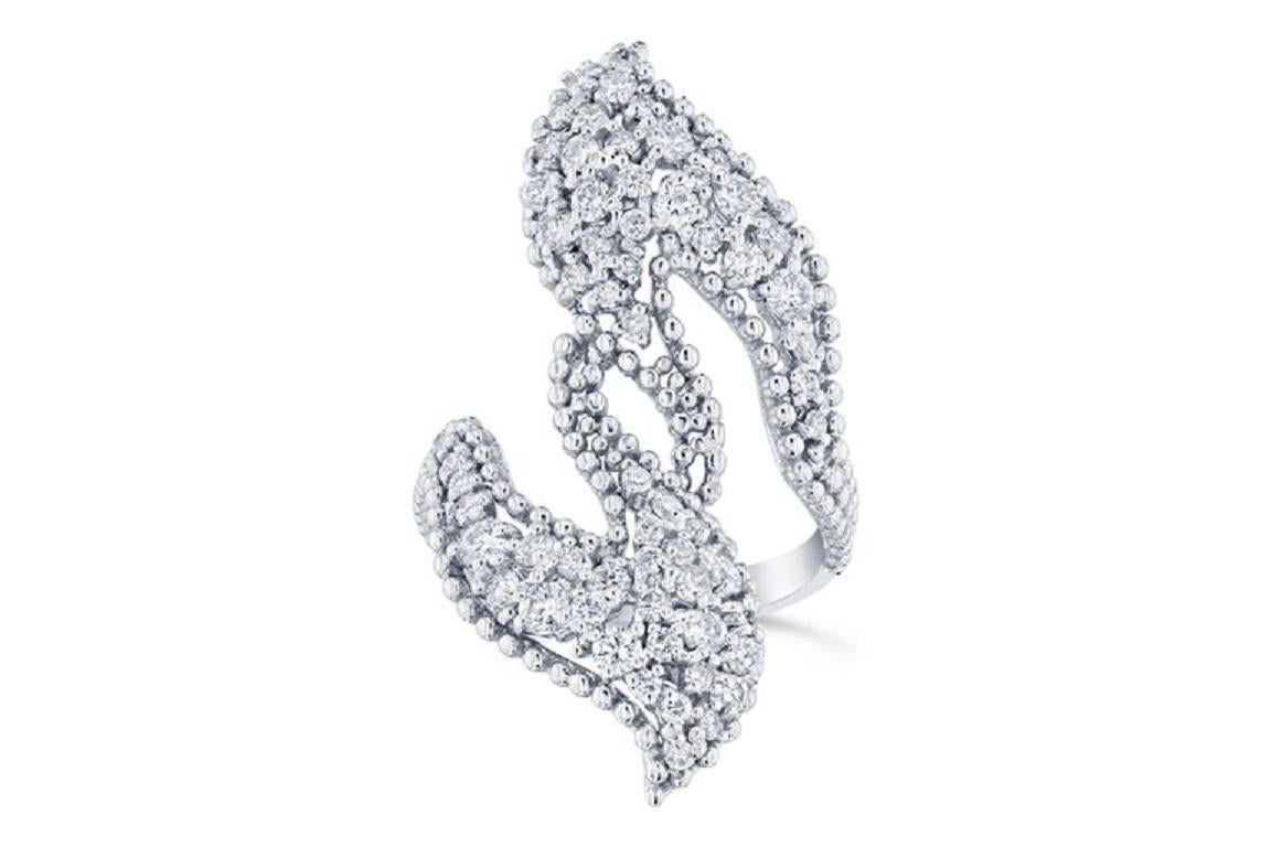 Bold and Beautiful Cocktail Ring with Diamonds. 

This ring has 64 Round Cut Diamonds that weigh 1.49 Carats (Clarity: VS2, Color: F).  
It is crafted in 14 Karat White Gold and has an approximate weight of 6.7 grams. 

The ring is a size 7 and can