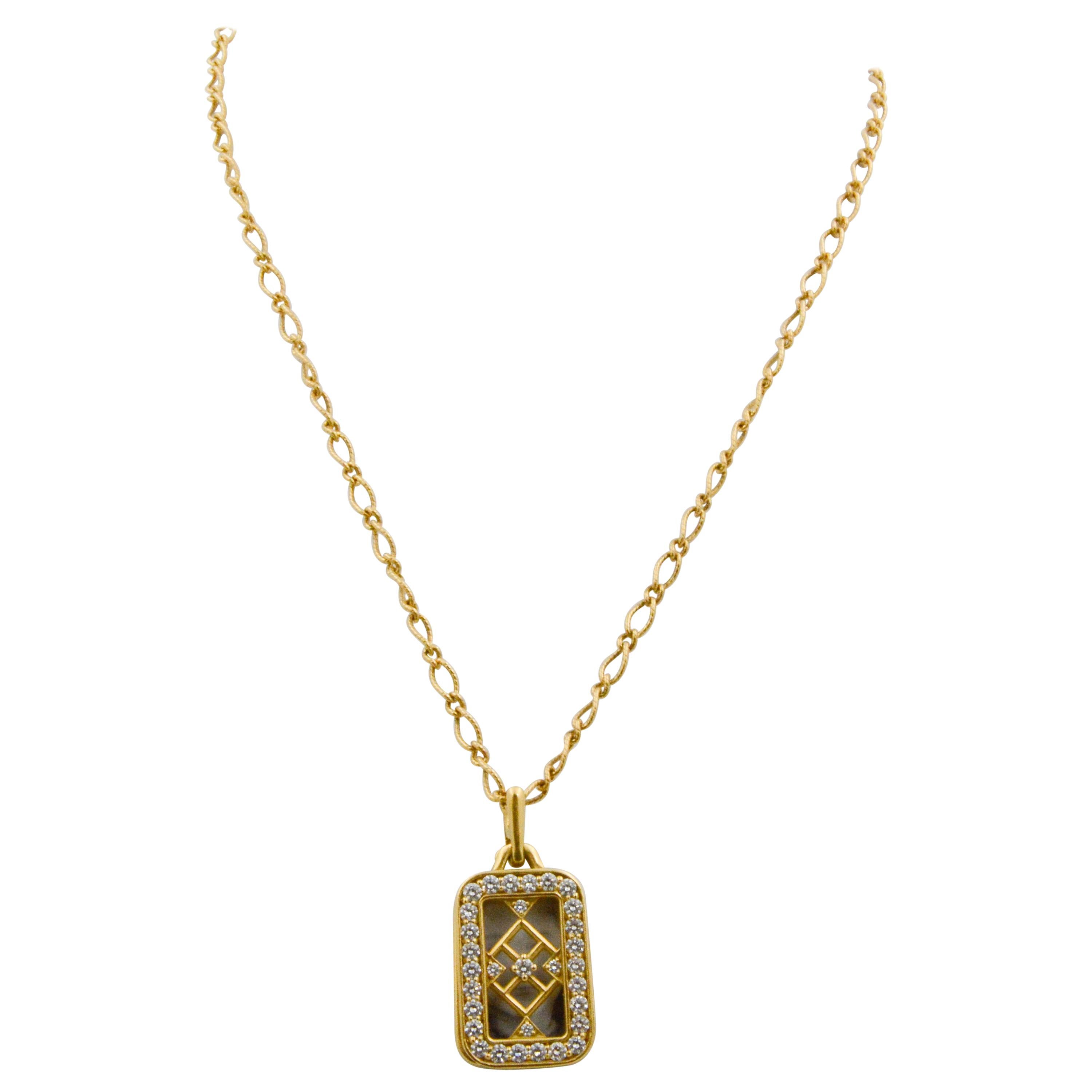 This Monica Rich Kosann 18k yellow gold pendant has three moving rectangular panels. The front panel has graphic open design, adorned with round brilliant cut diamonds, 1.43ctw G-H color and VS clarity and 18k yellow gold. The other pendant panels