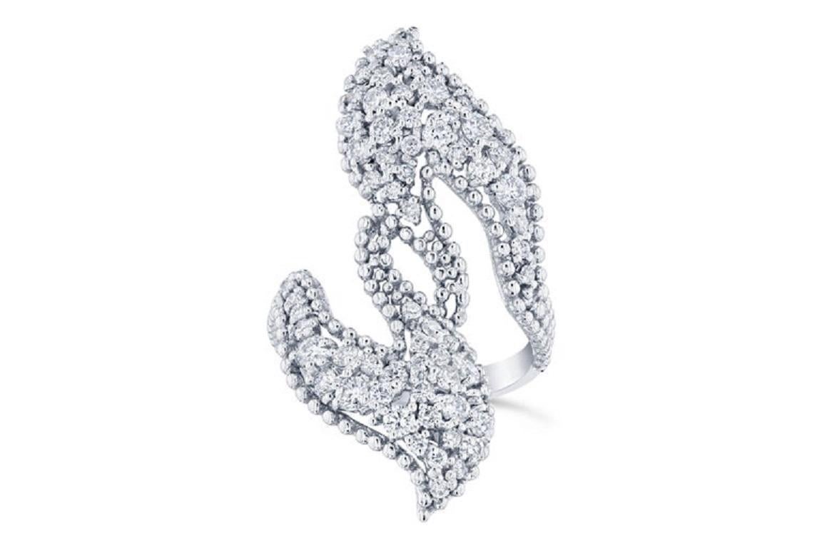 This cocktail ring has 64 Round Cut Diamonds that weigh 1.49 Carats (Clarity: VS2, Color: F).  
It is crafted in 14 Karat White Gold and has an approximate weight of 6.7 grams. 

The ring is a size 7 and can be re-sized at no additional charge! 