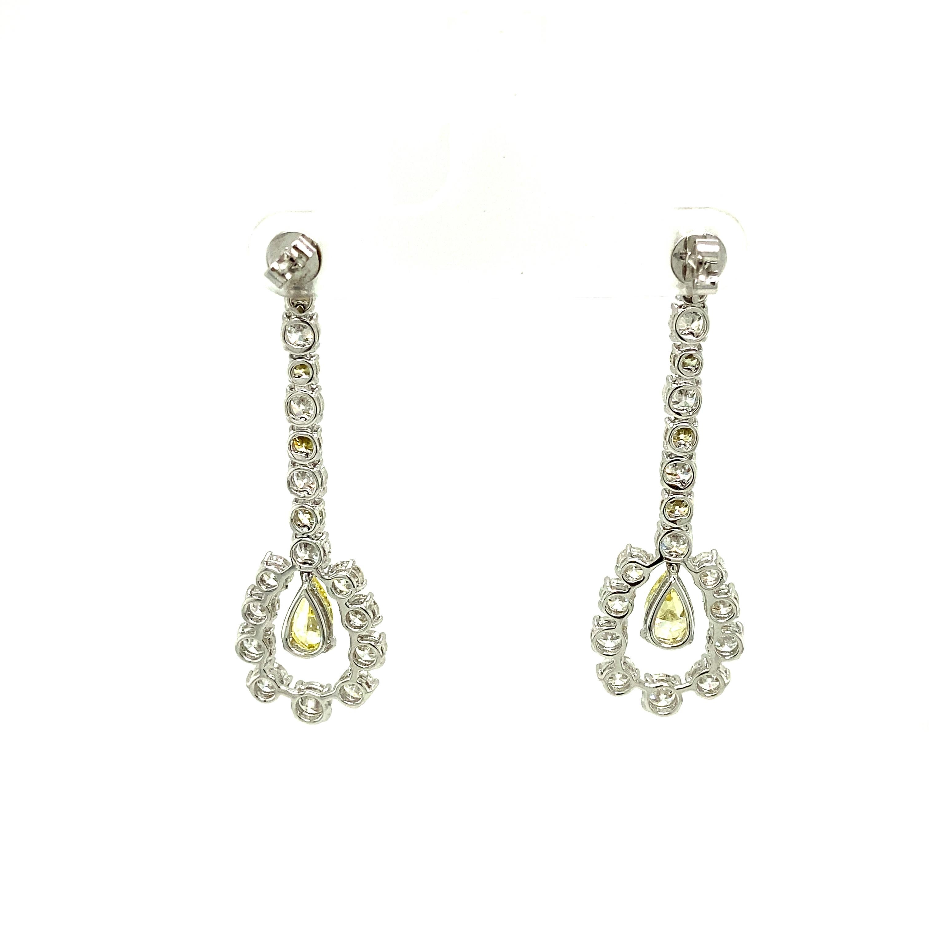 Women's 1.43 Carat GIA Certified Fancy Intense Yellow Diamonds and Diamond Gold Earrings For Sale