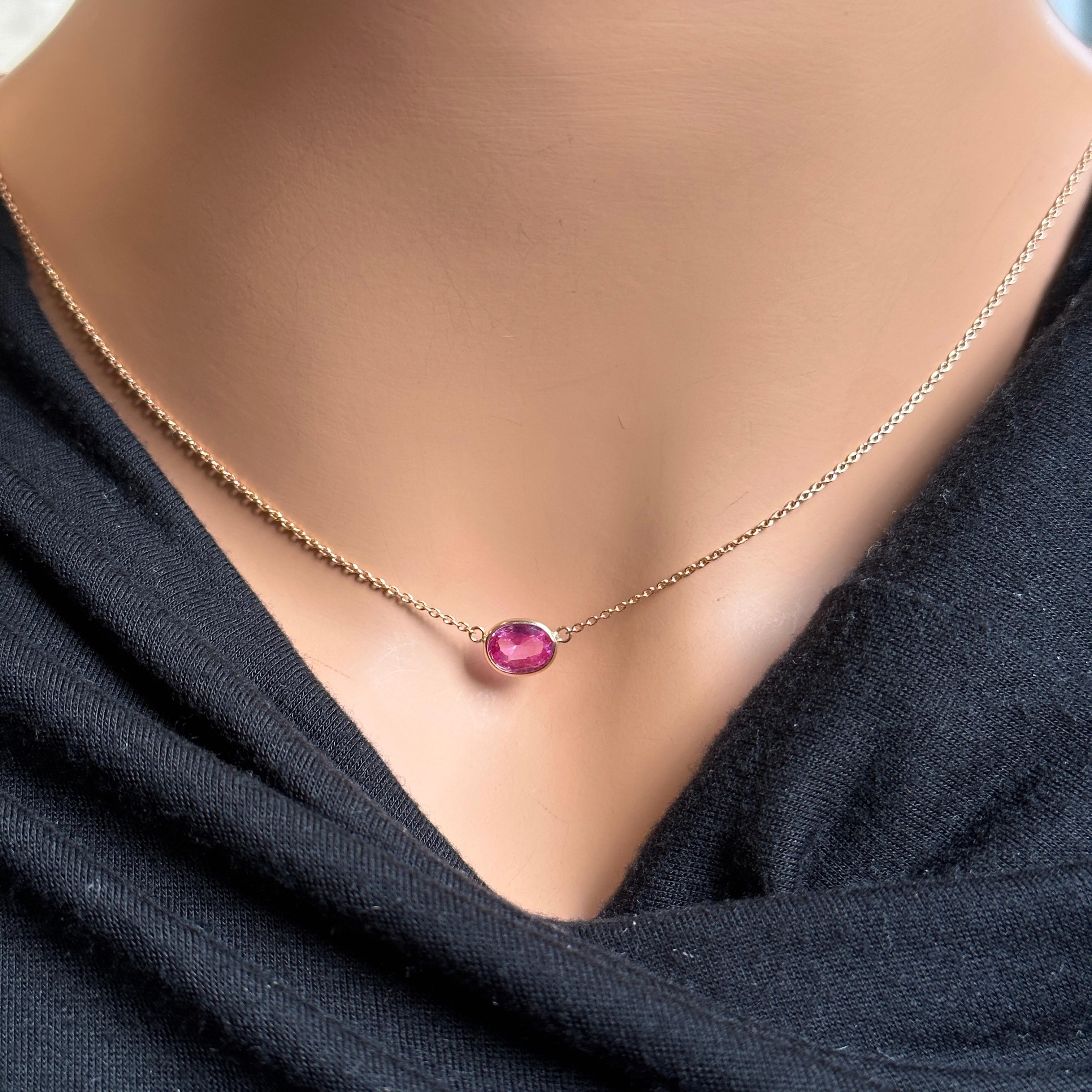 The 1.43 carat oval-cut pink sapphire would be the centerpiece of the necklace, showcasing its beautiful pink hue and natural clarity. The oval cut features a symmetrical and elongated shape that enhances the sapphire's sparkle and creates a classic