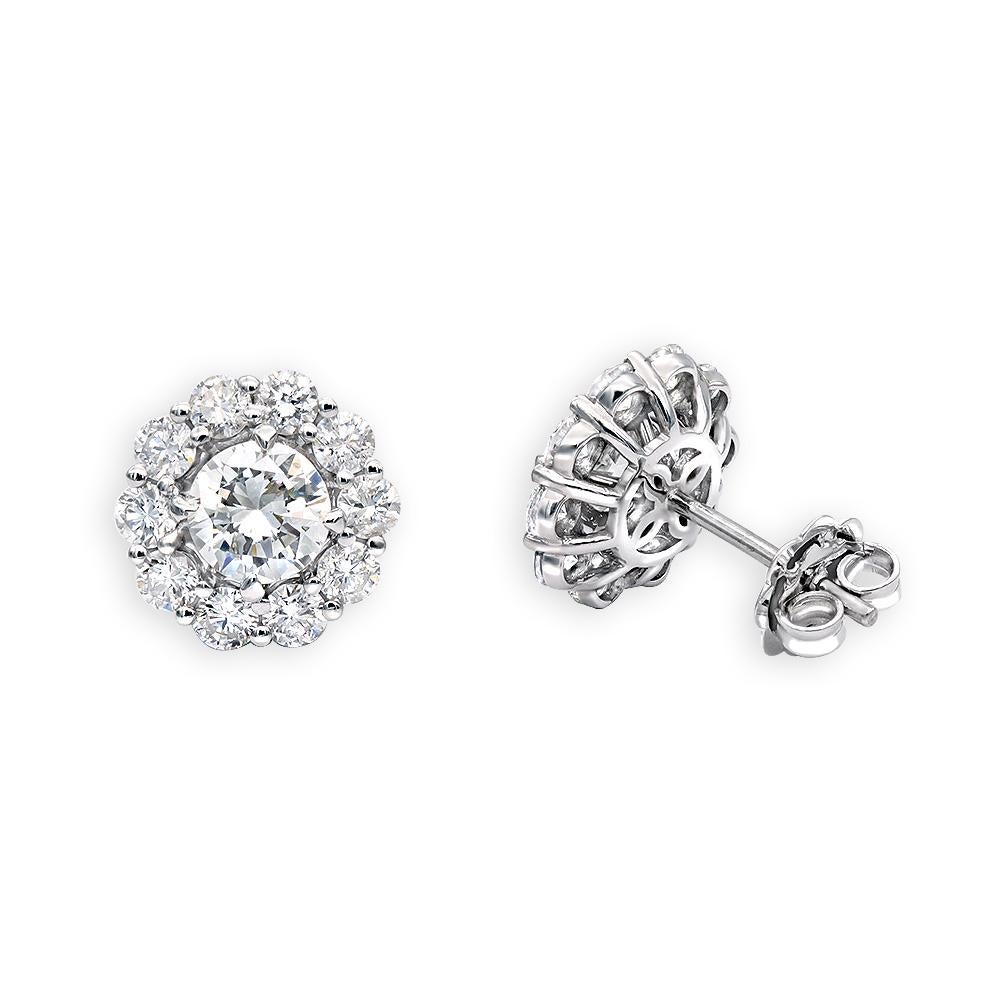 Ladies beautiful round  brilliant diamond cluster stud earrings.
Handcrafted in 14k white gold.
Center stone is 1.43 carat brilliant diamond.
Sides contain 0.85 carat round brilliant diamonds.
