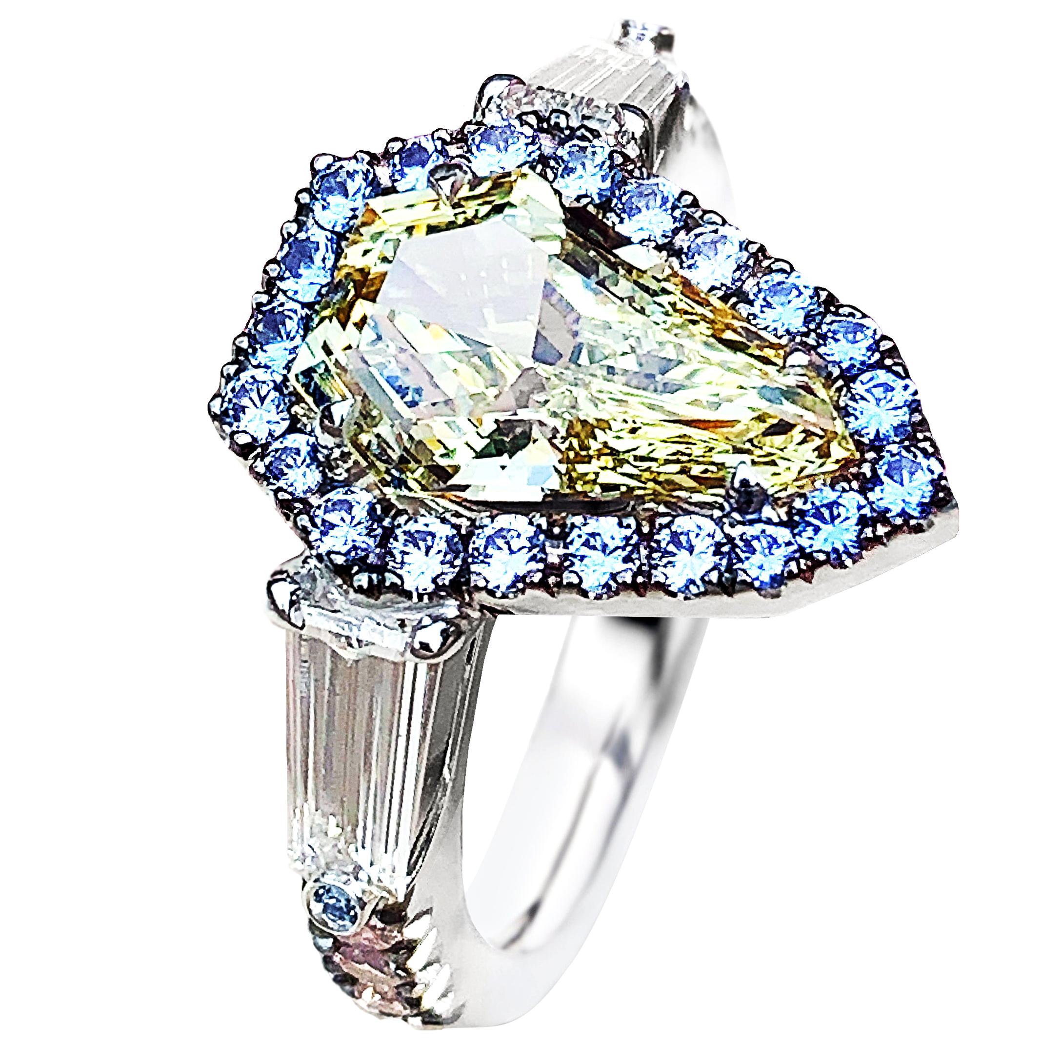 1.43 Carat VVS2 GIA Fancy Yellow Shield Cut Diamond, Unheated Blue Sapphire Ring
